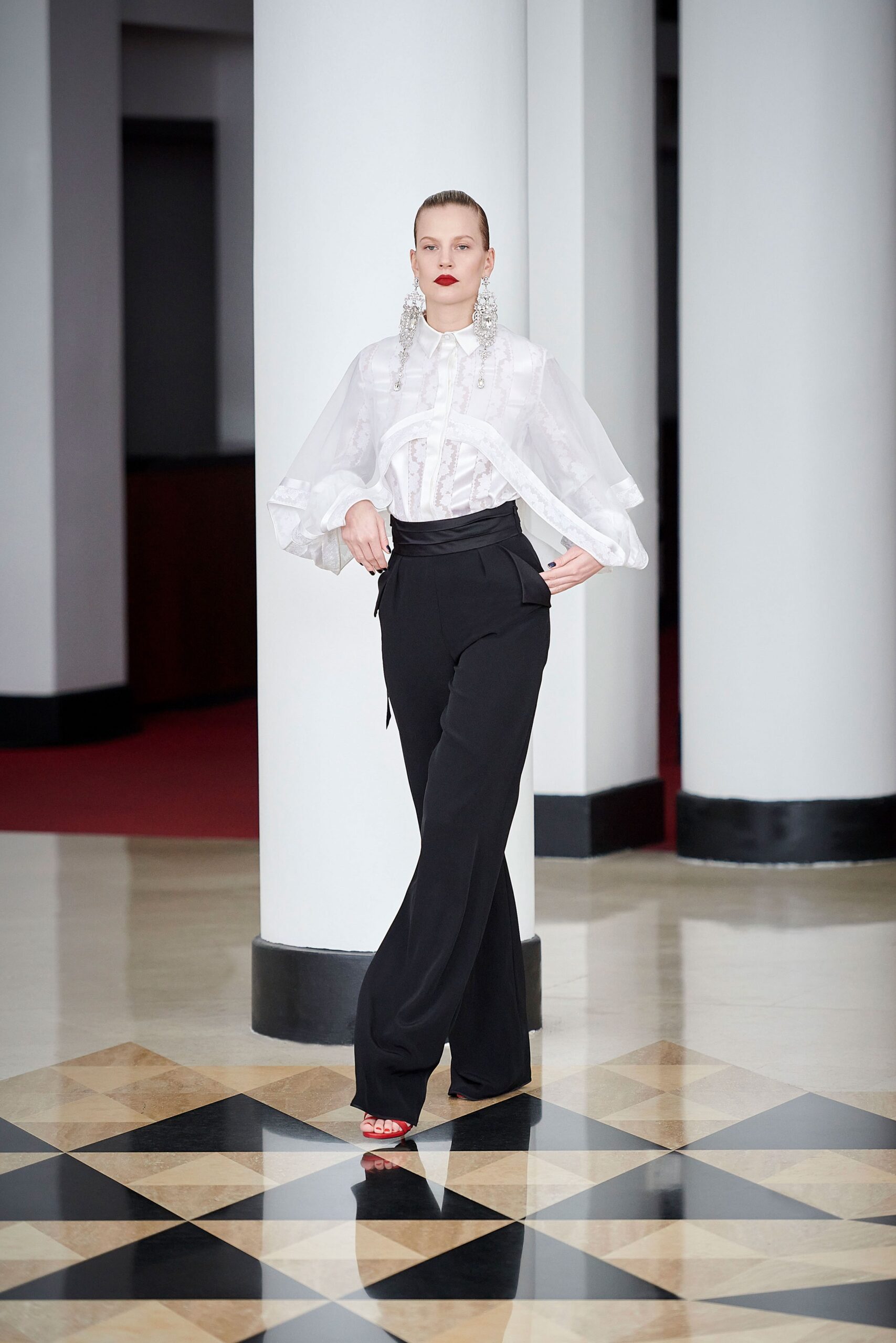 white ruffled blouse black tailored pants