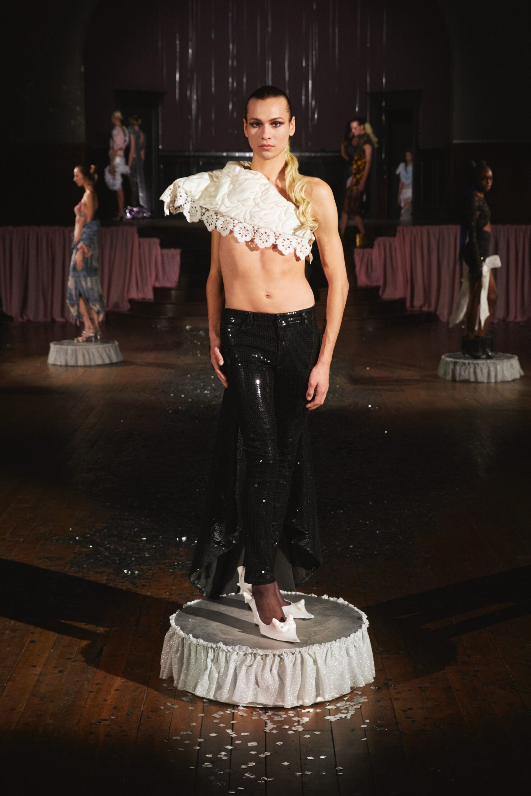 white off-shoulder top with black pants