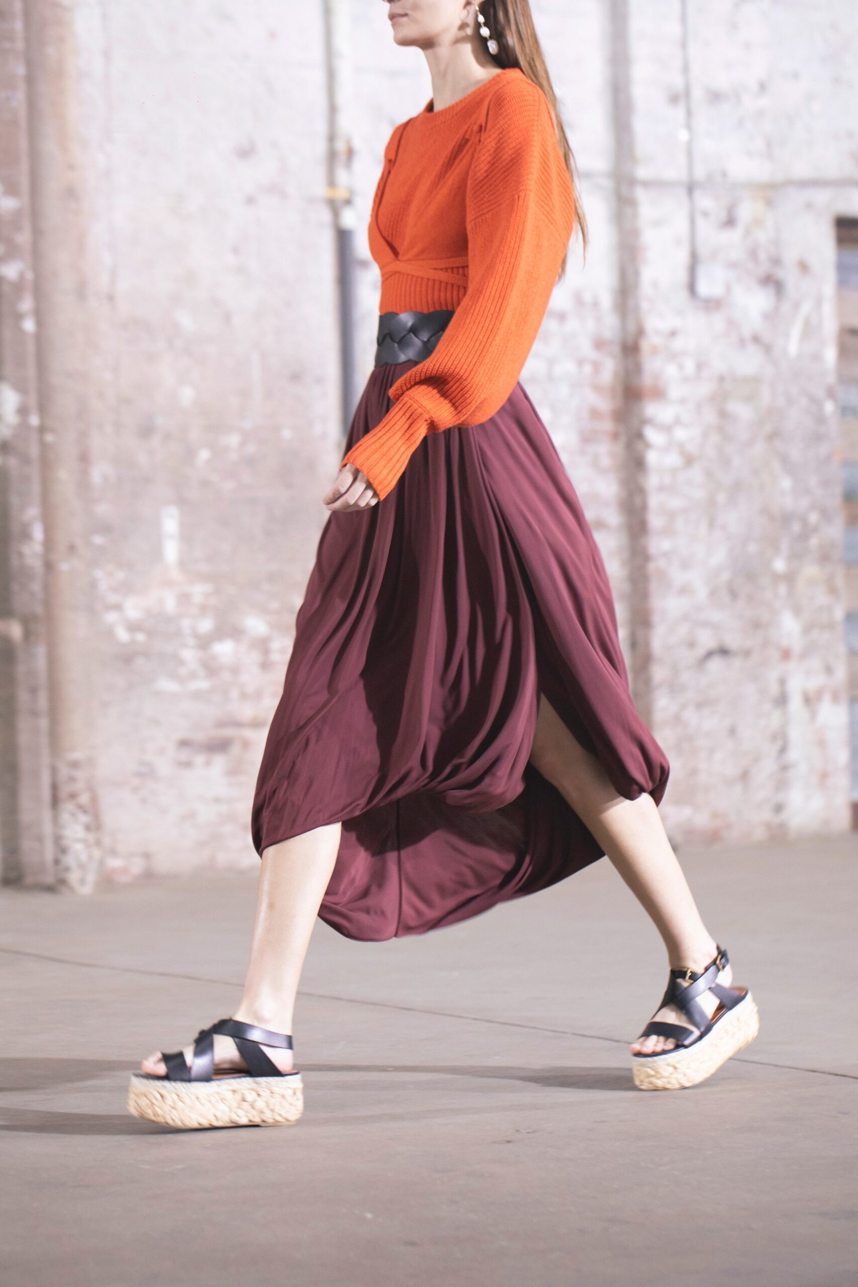 orange knit top maroon skirt