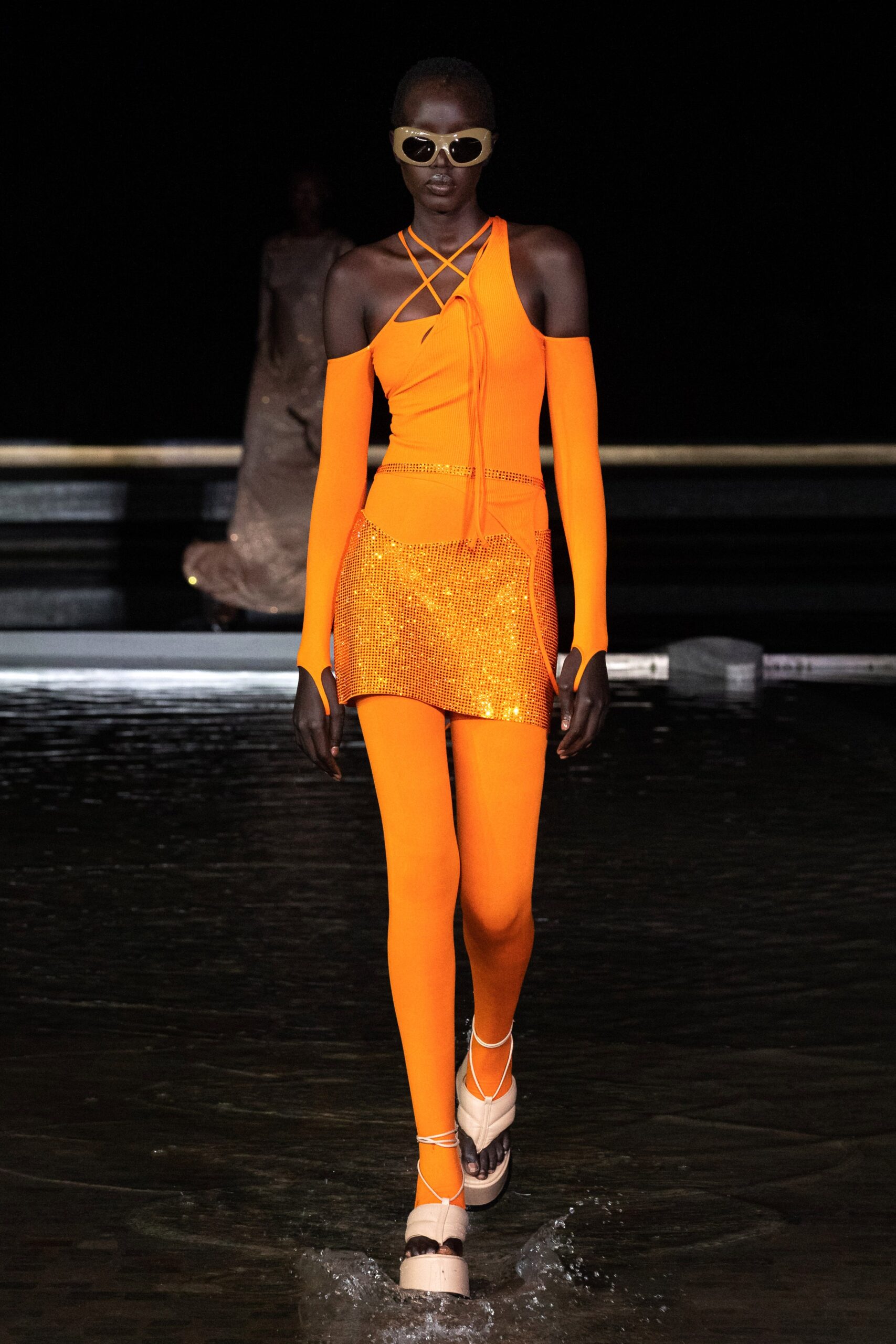 orange fitted top and pants