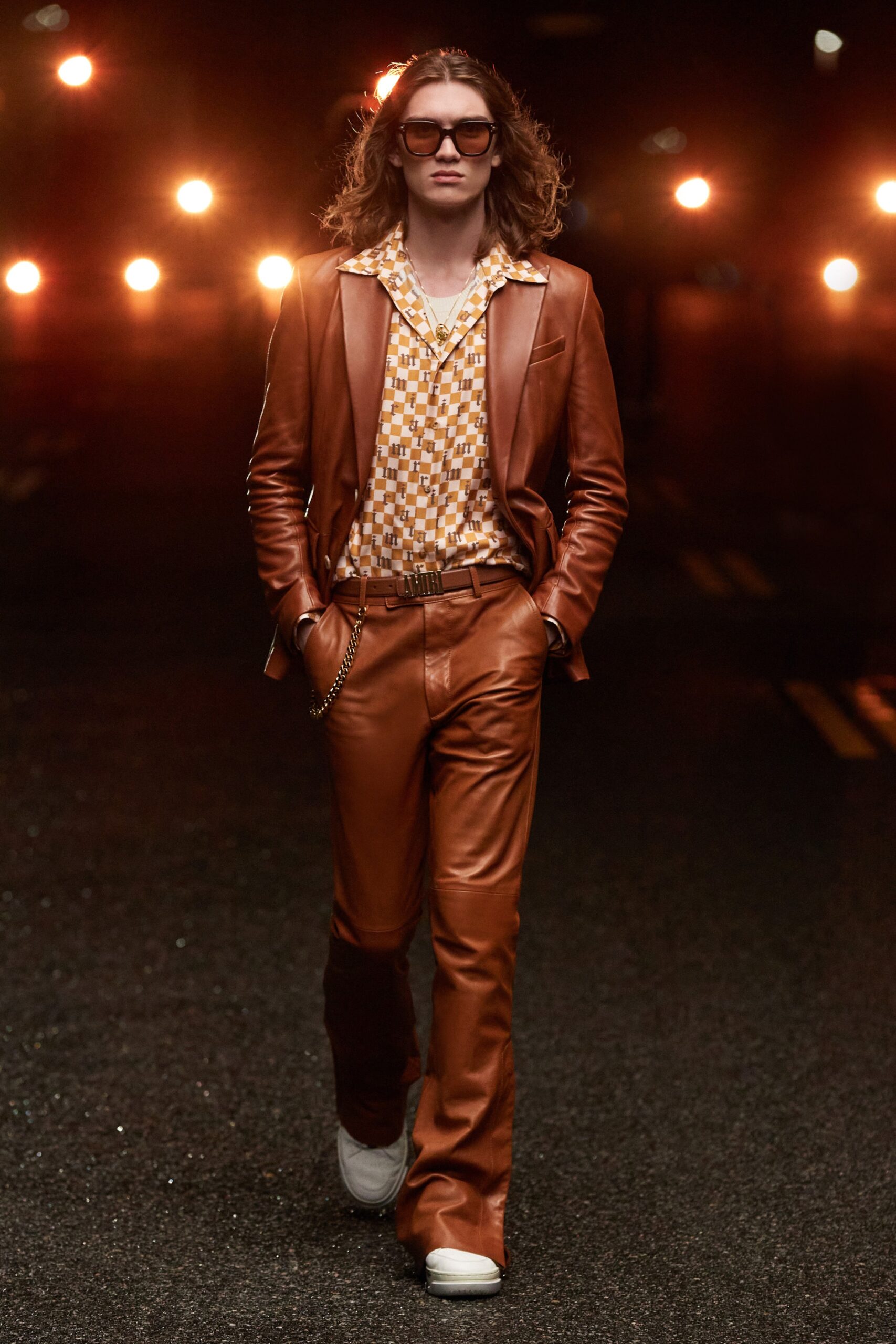 orange leather suit with printed shirt
