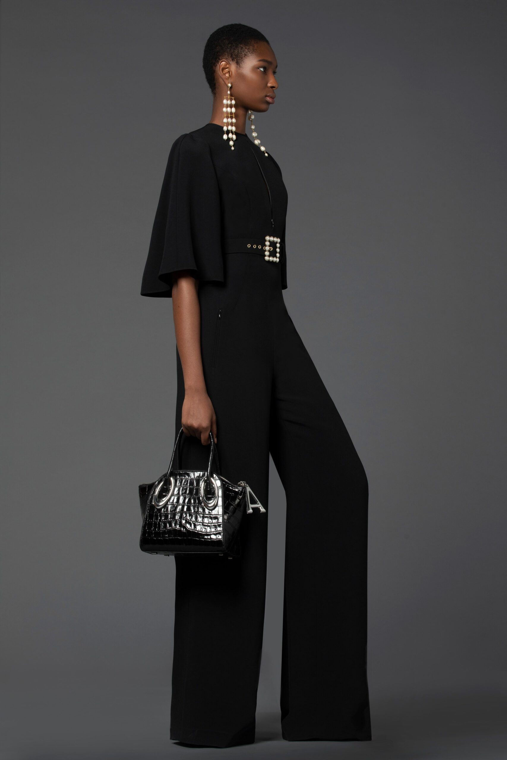 black fitted jumpsuit with wide legs
