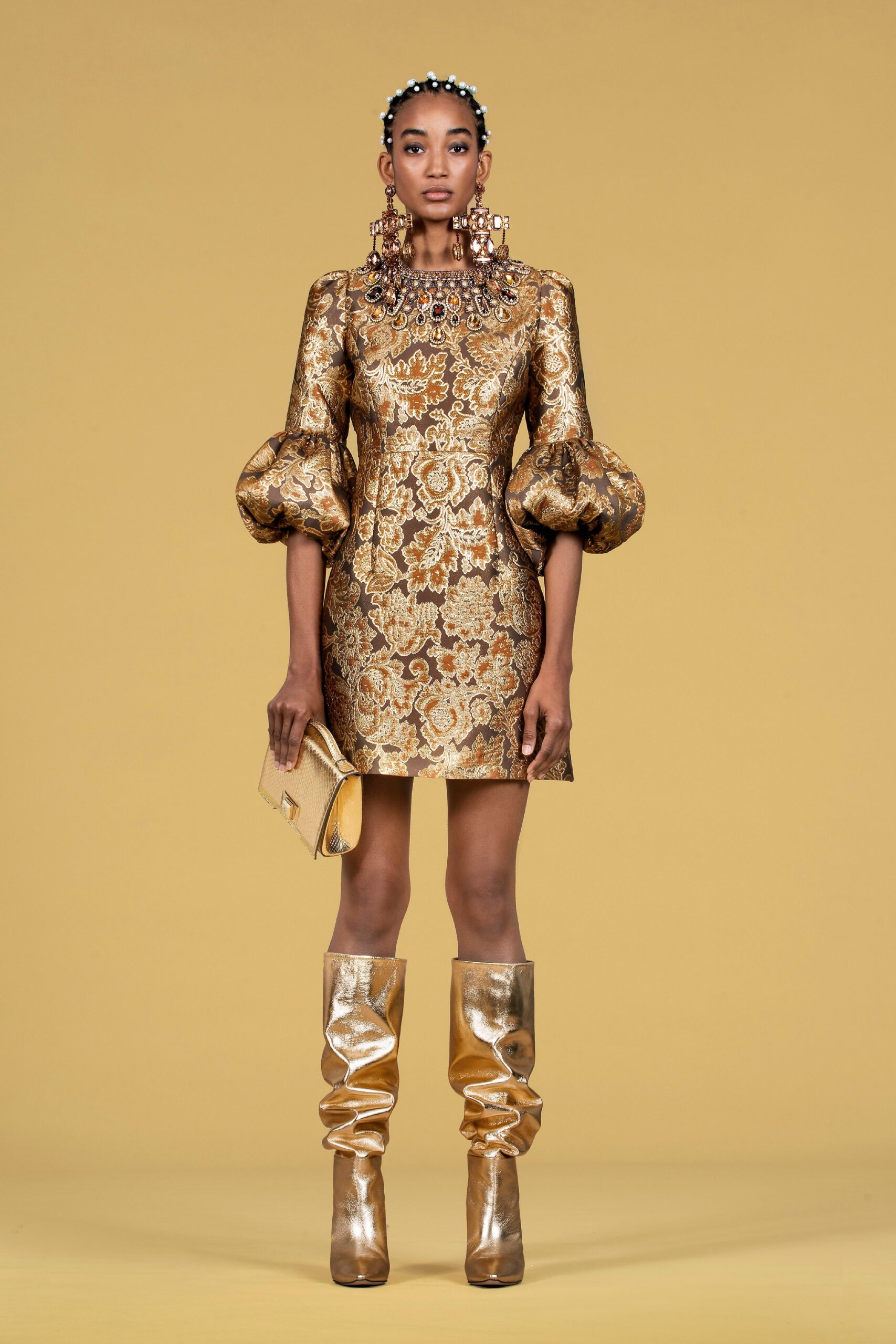 gold brocade mini-dress with boots