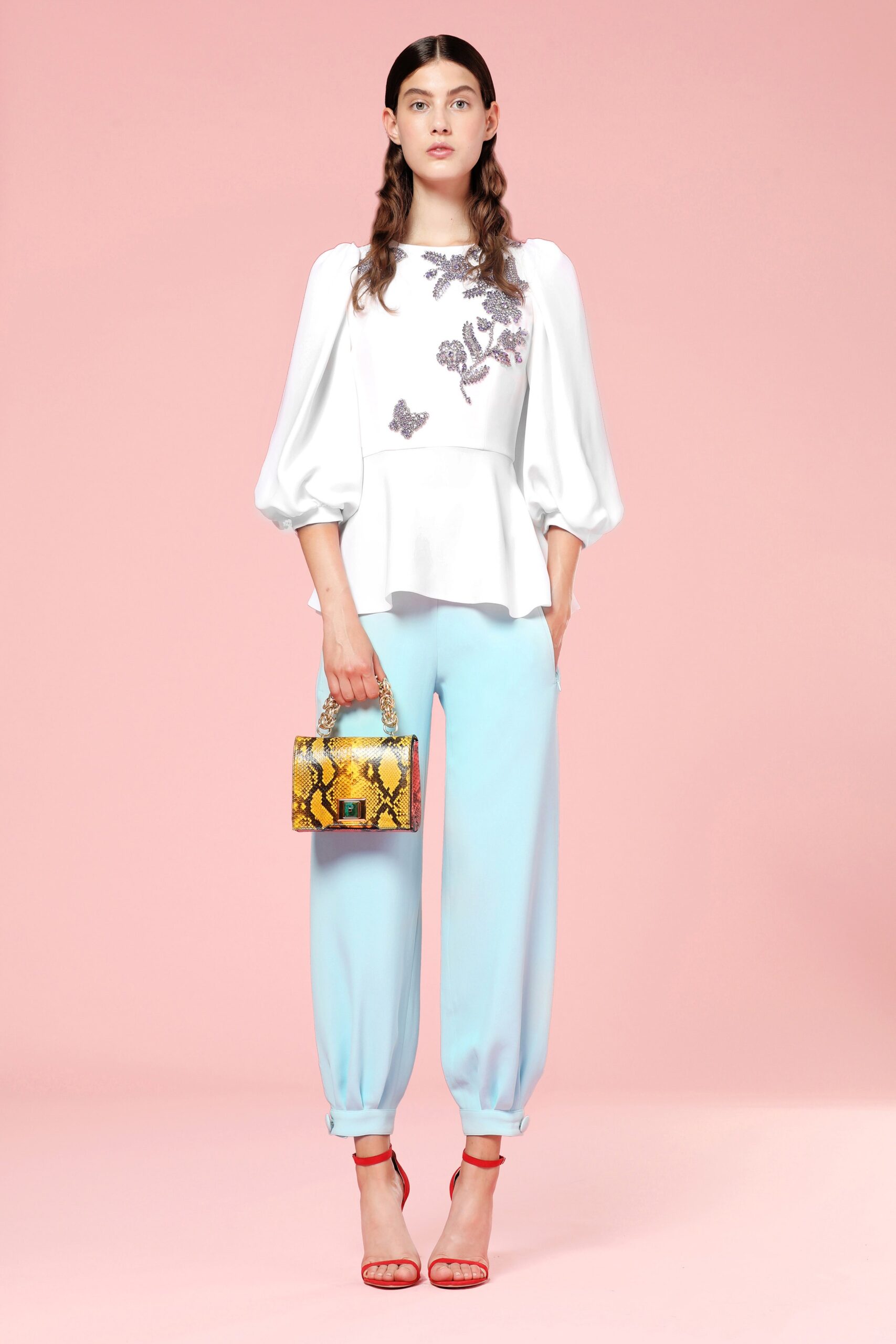 white embroidered top with blue pants