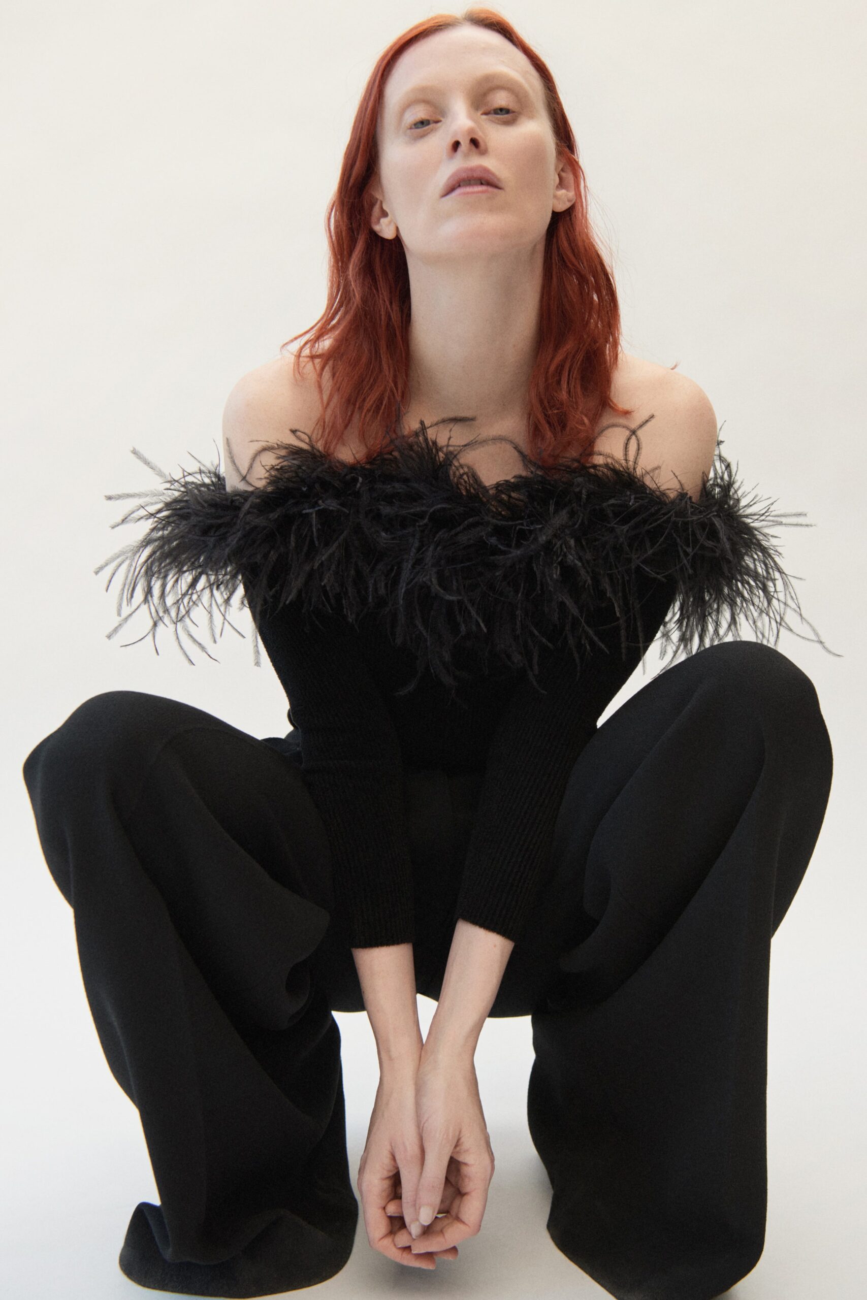 black off-shoulder top and wide-leg pants