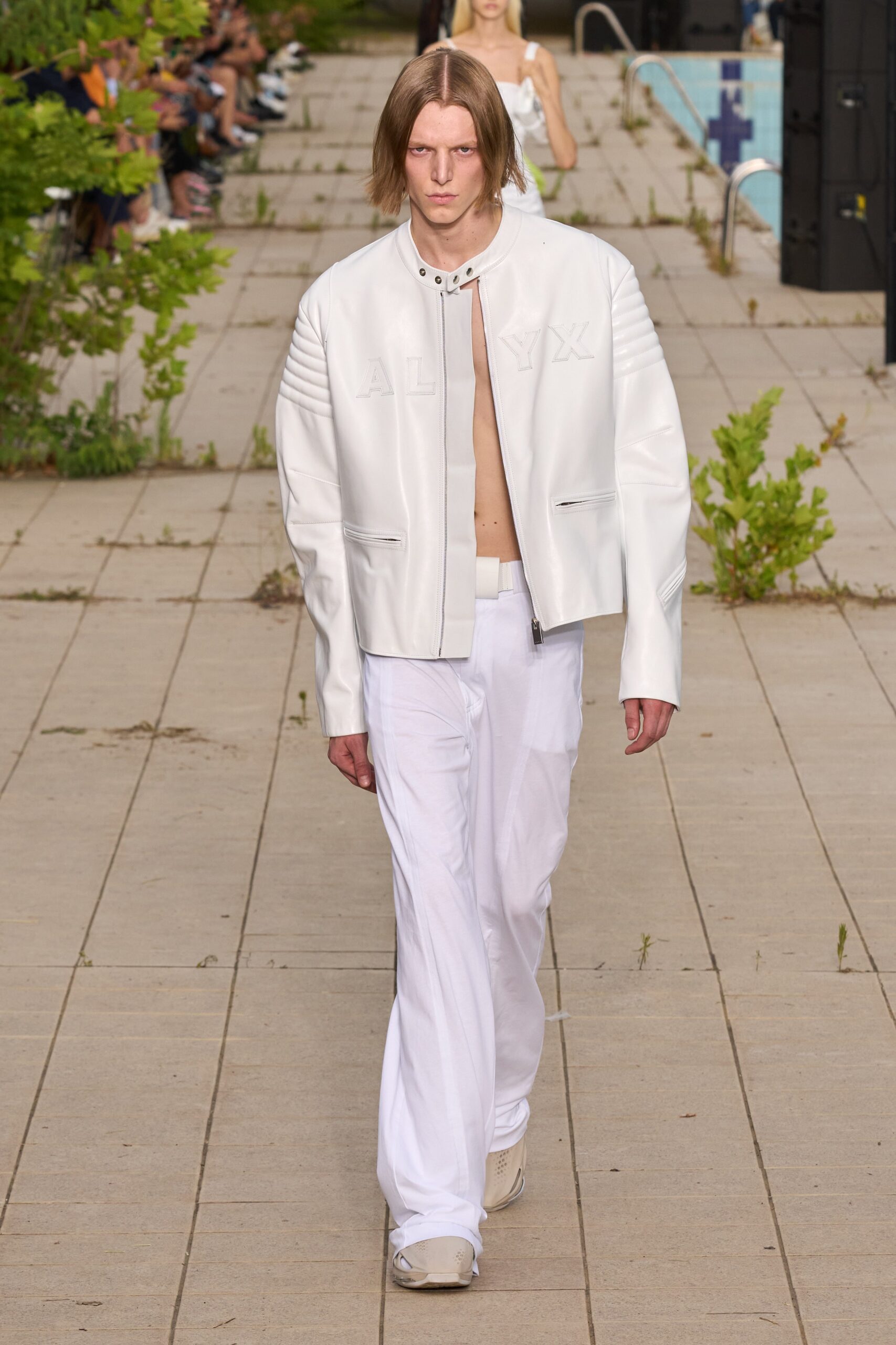 white leather jacket with relaxed pants