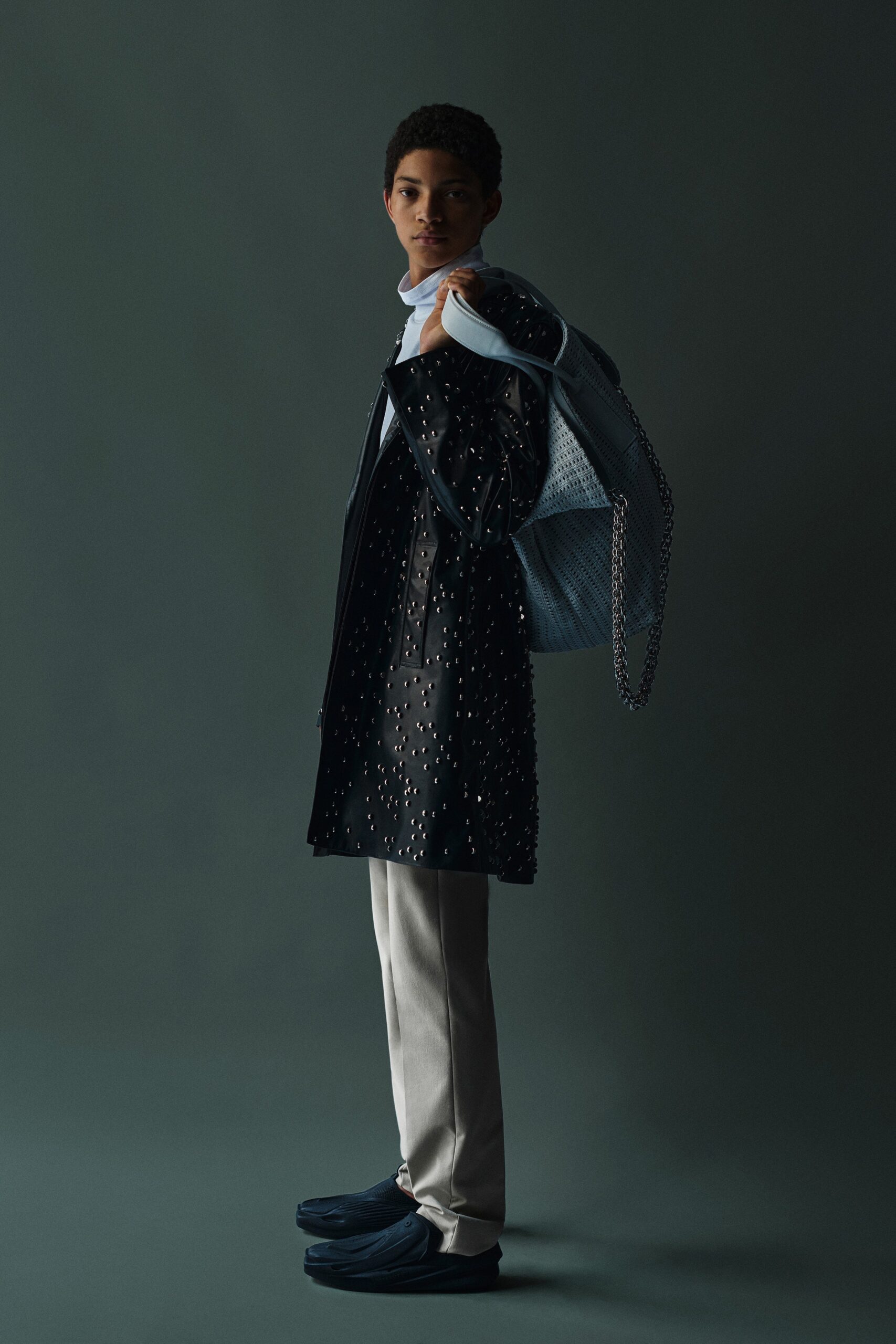 black leather coat with white pants