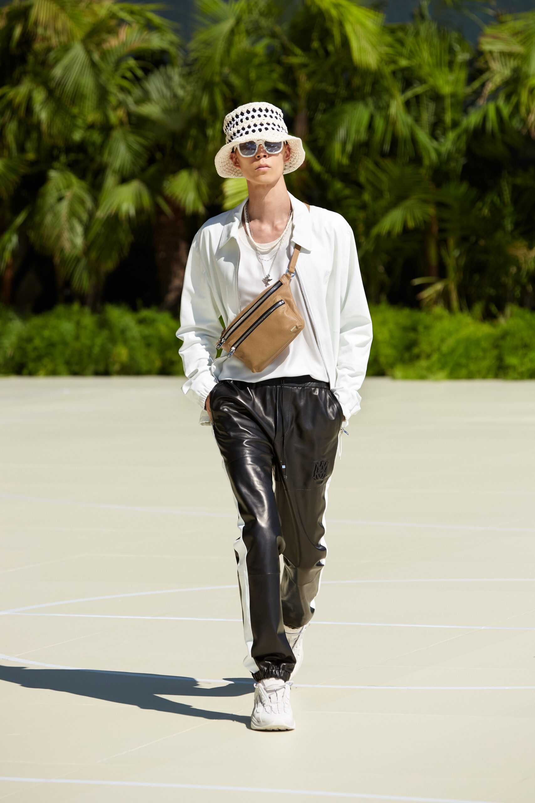 white relaxed shirt with black leather pants