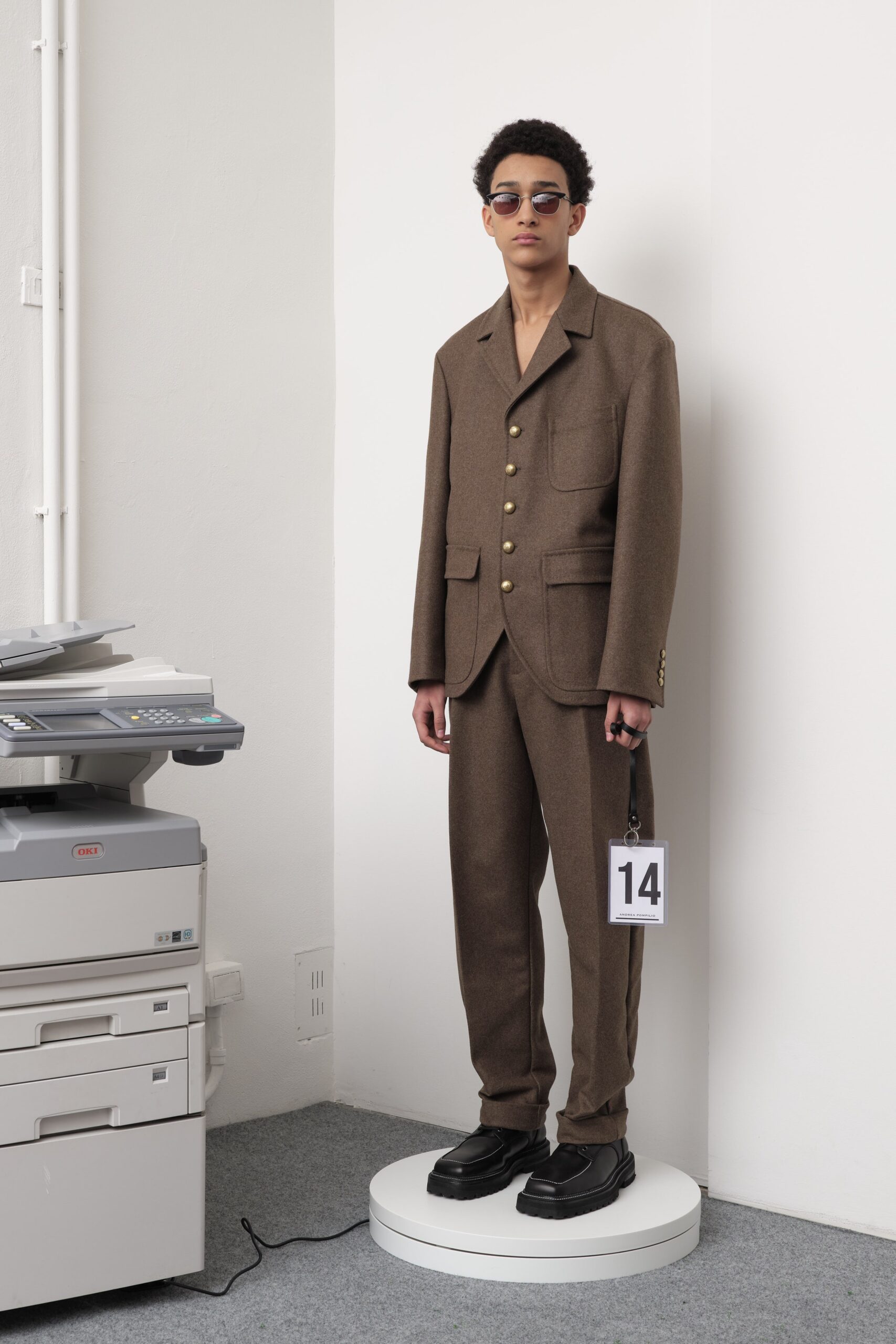 brown tailored suit with sunglasses