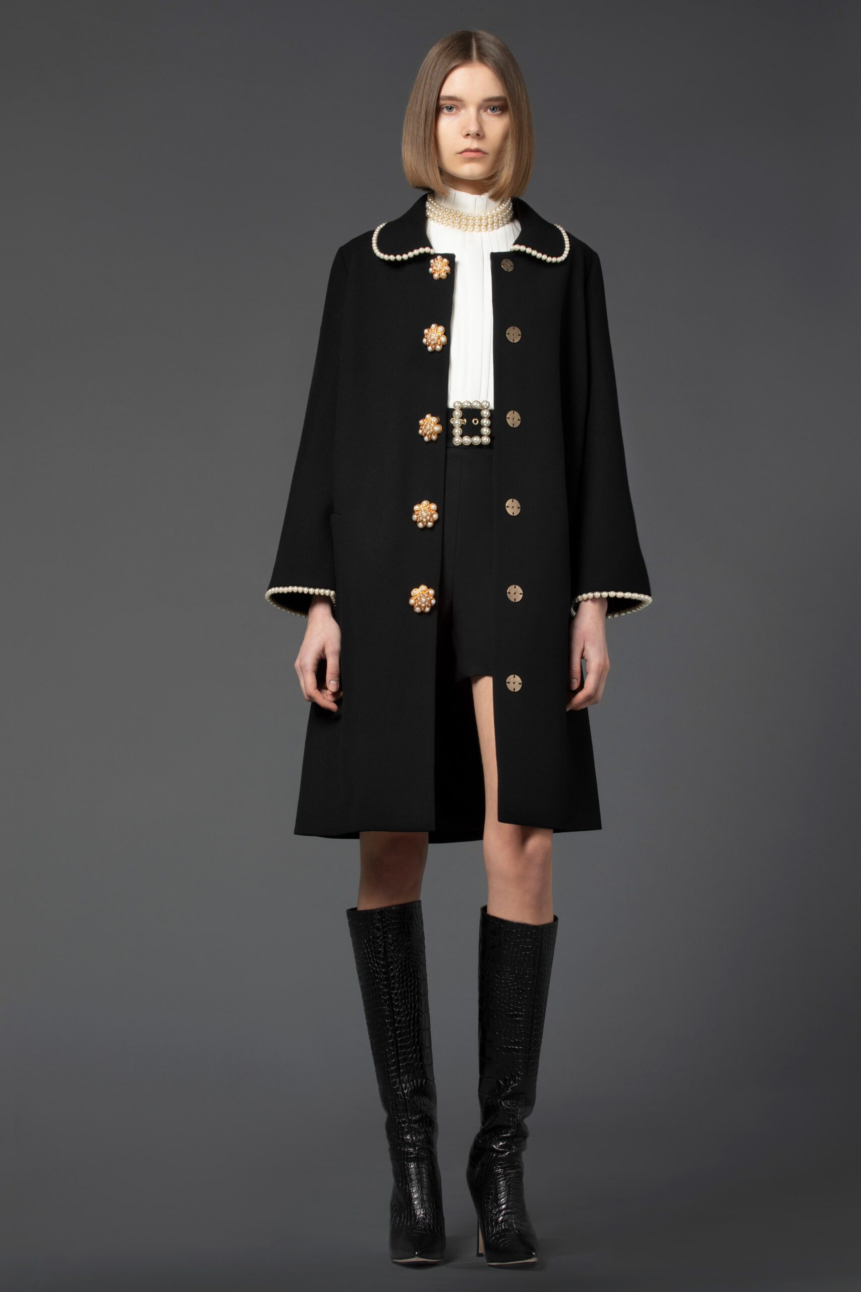 black coat with white top and shorts