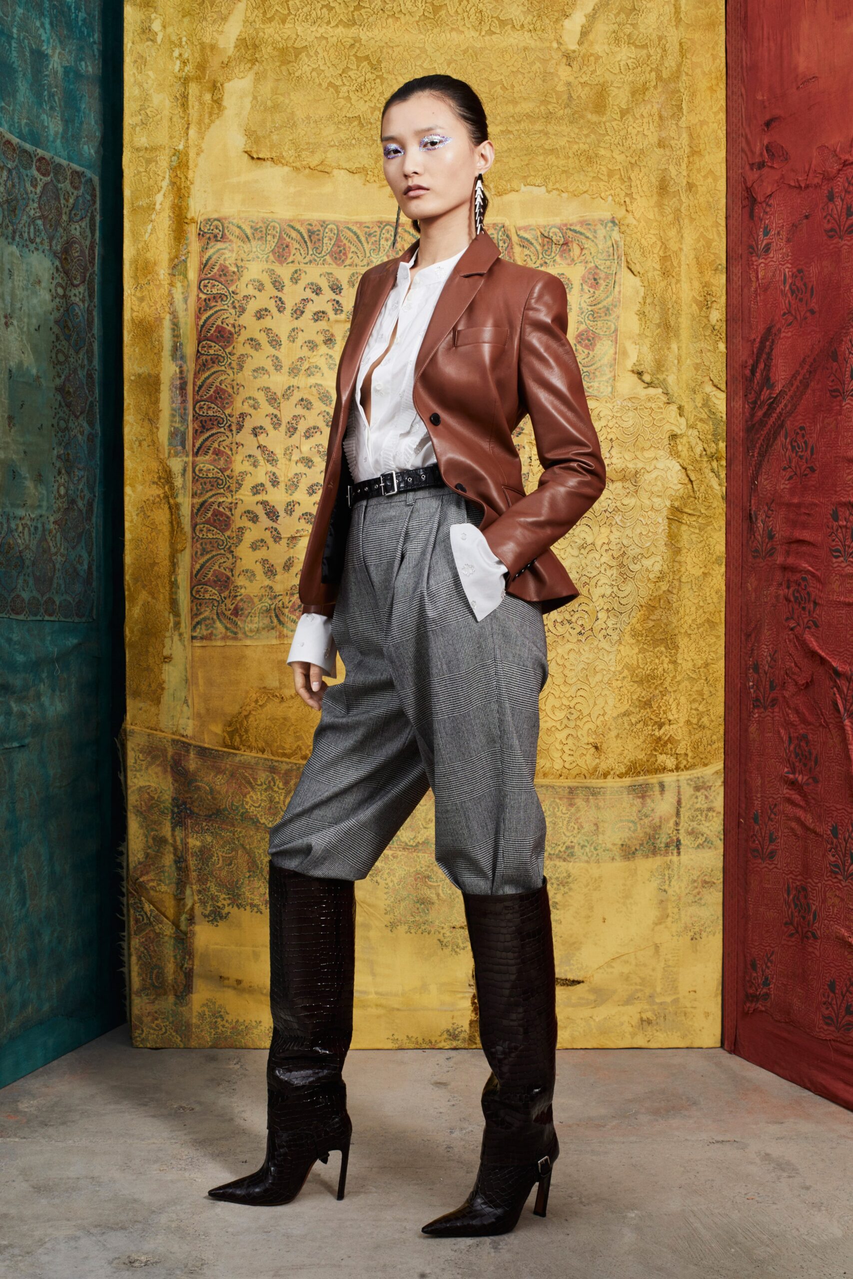 brown leather blazer with gray pants