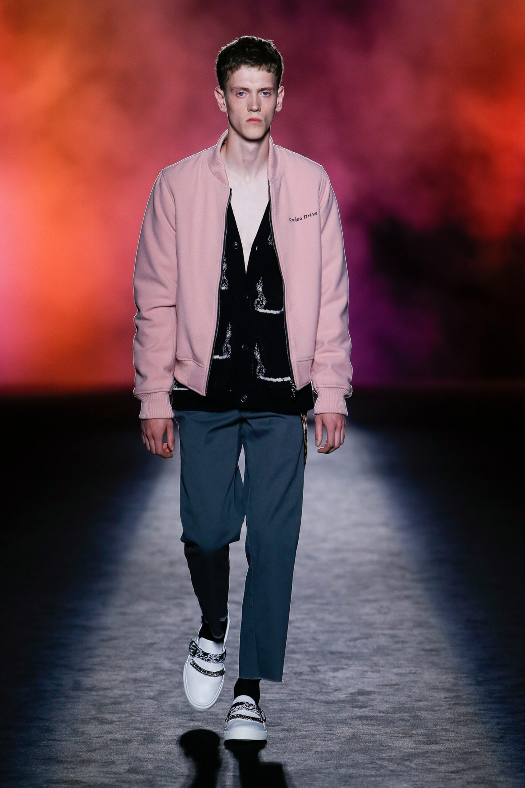 pink jacket black shirt gray pants