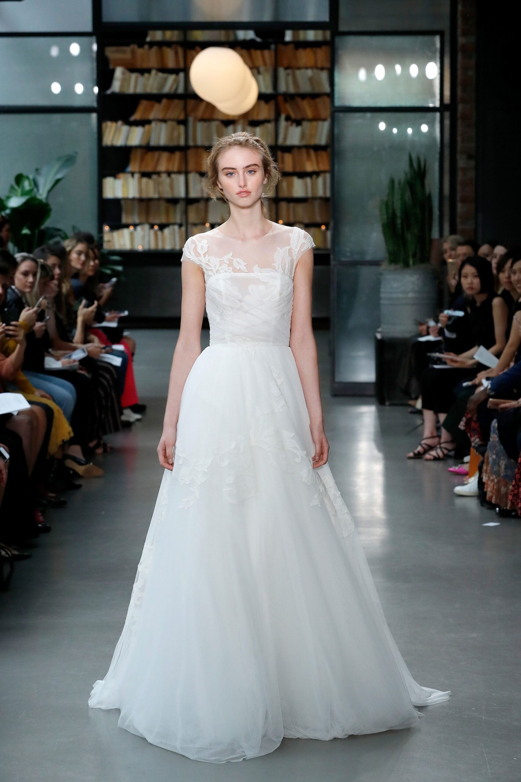 white embroidered sleeveless gown