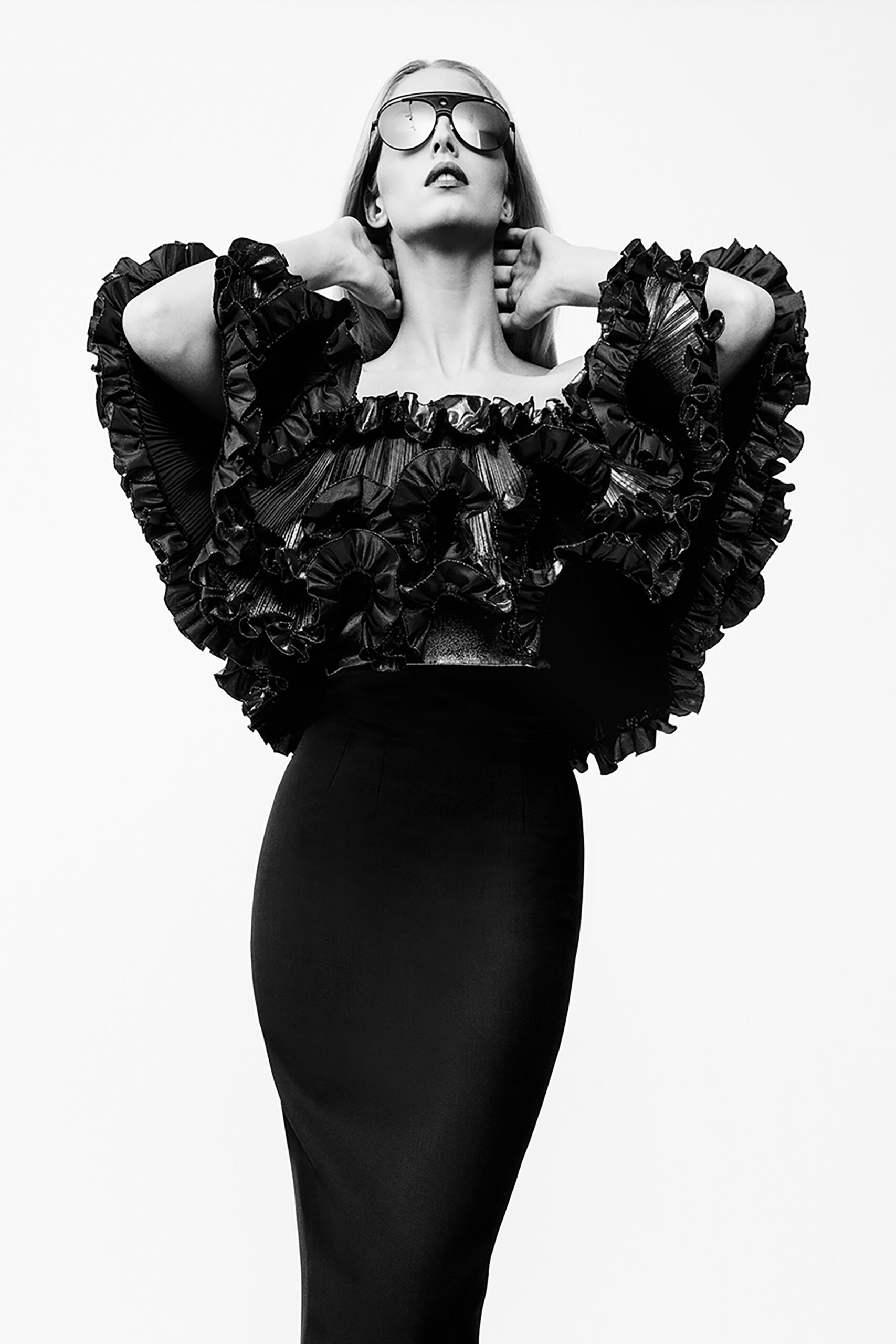 black ruffled top and pencil skirt
