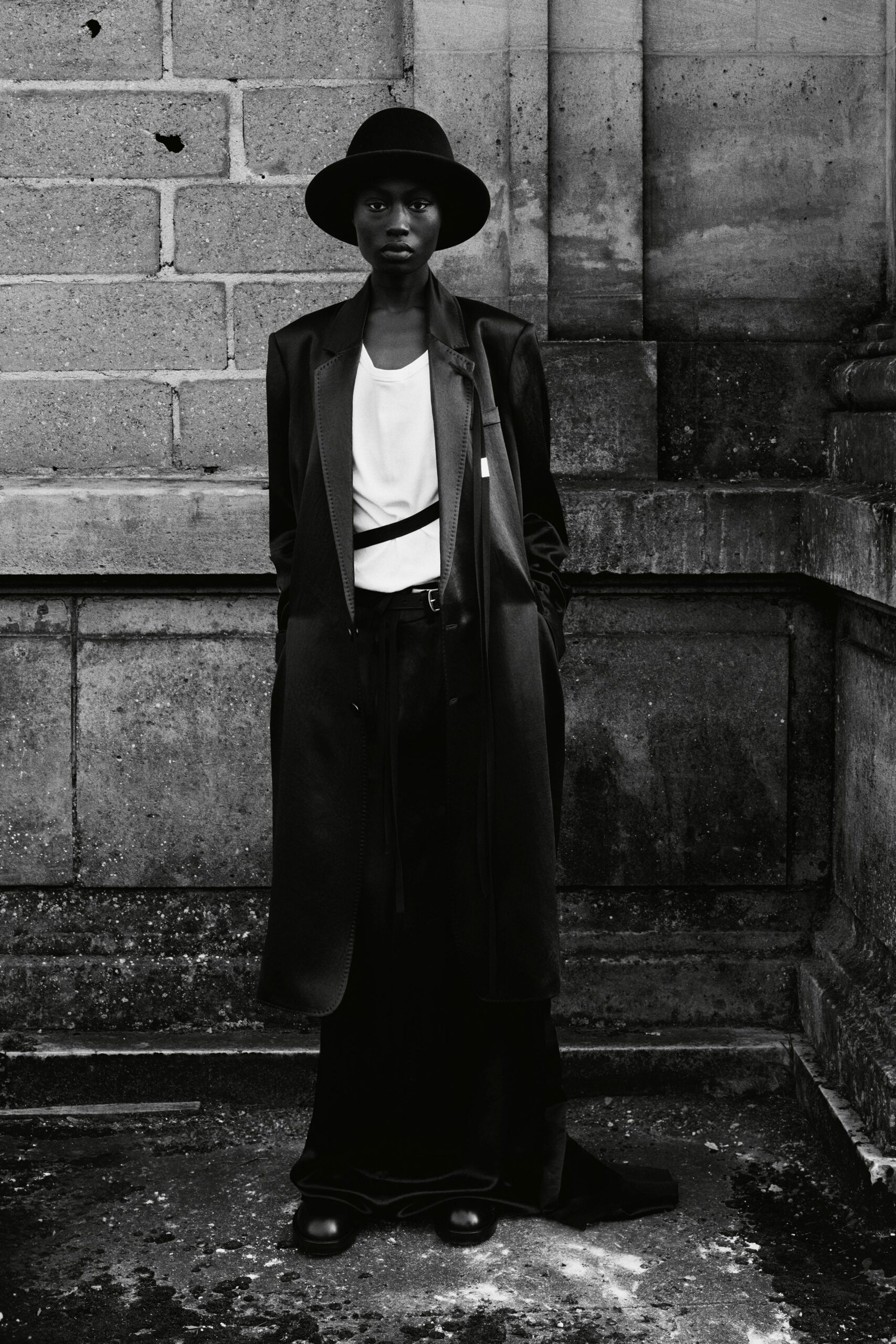 black coat white top black skirt