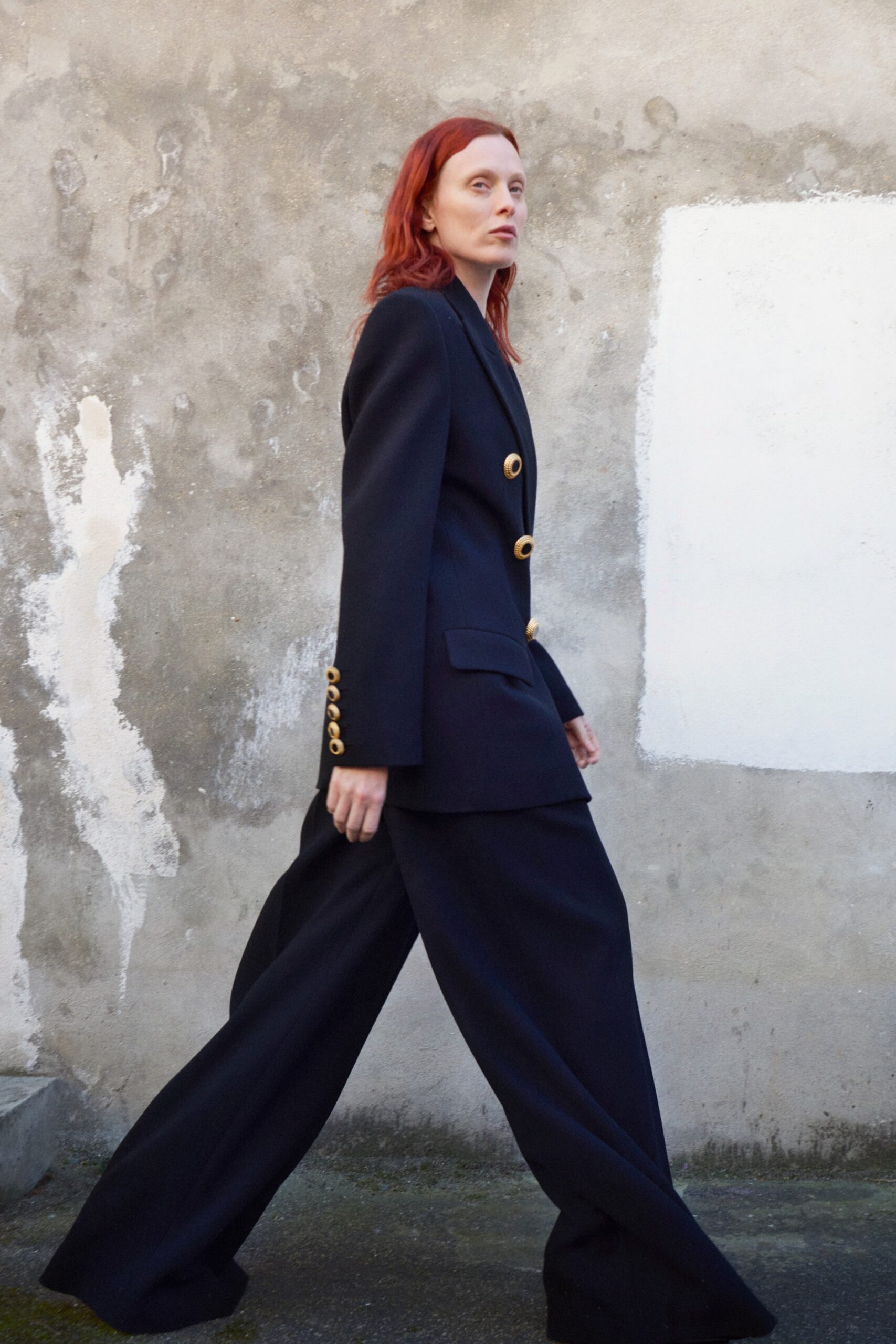 black tailored blazer and relaxed pants