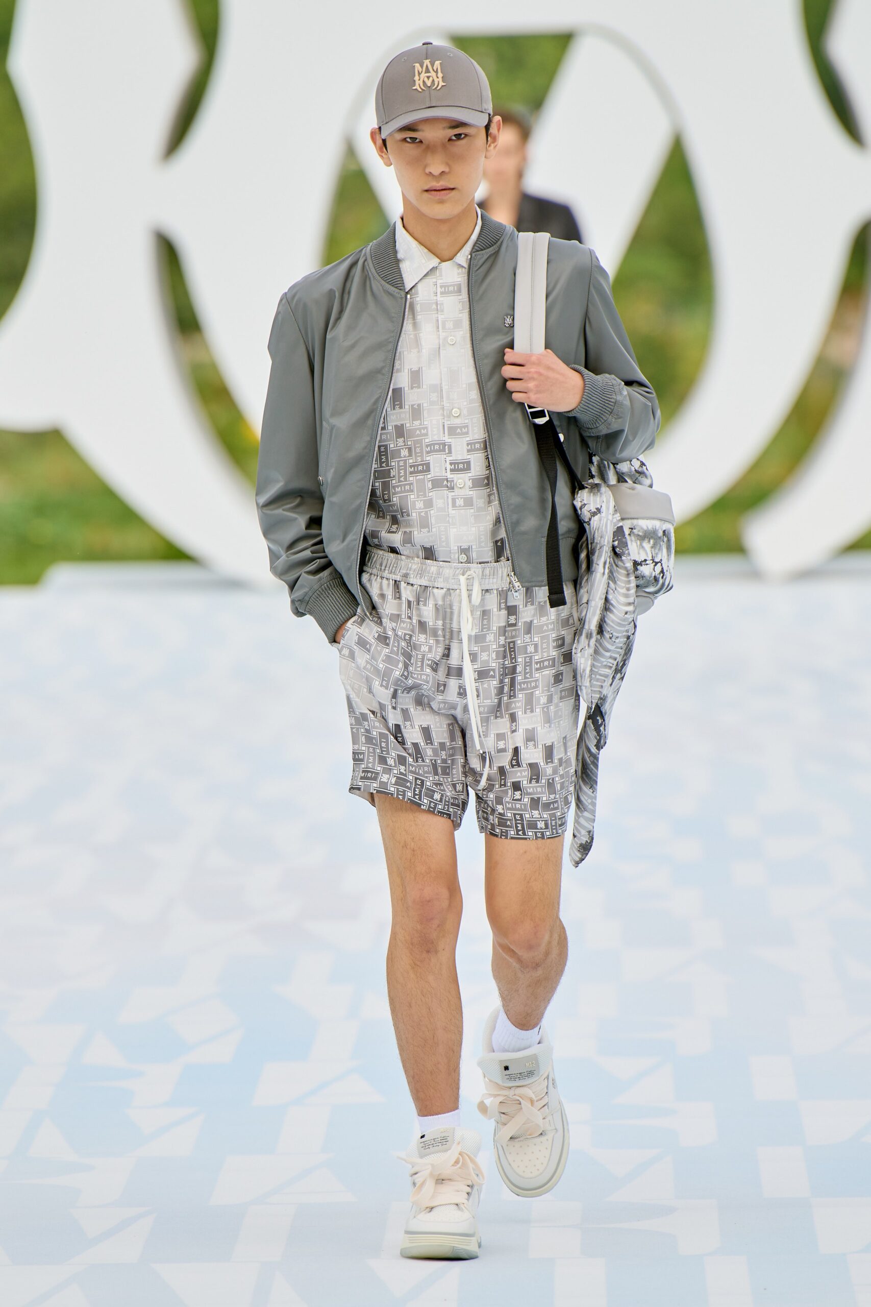 gray jacket white shirt gray shorts