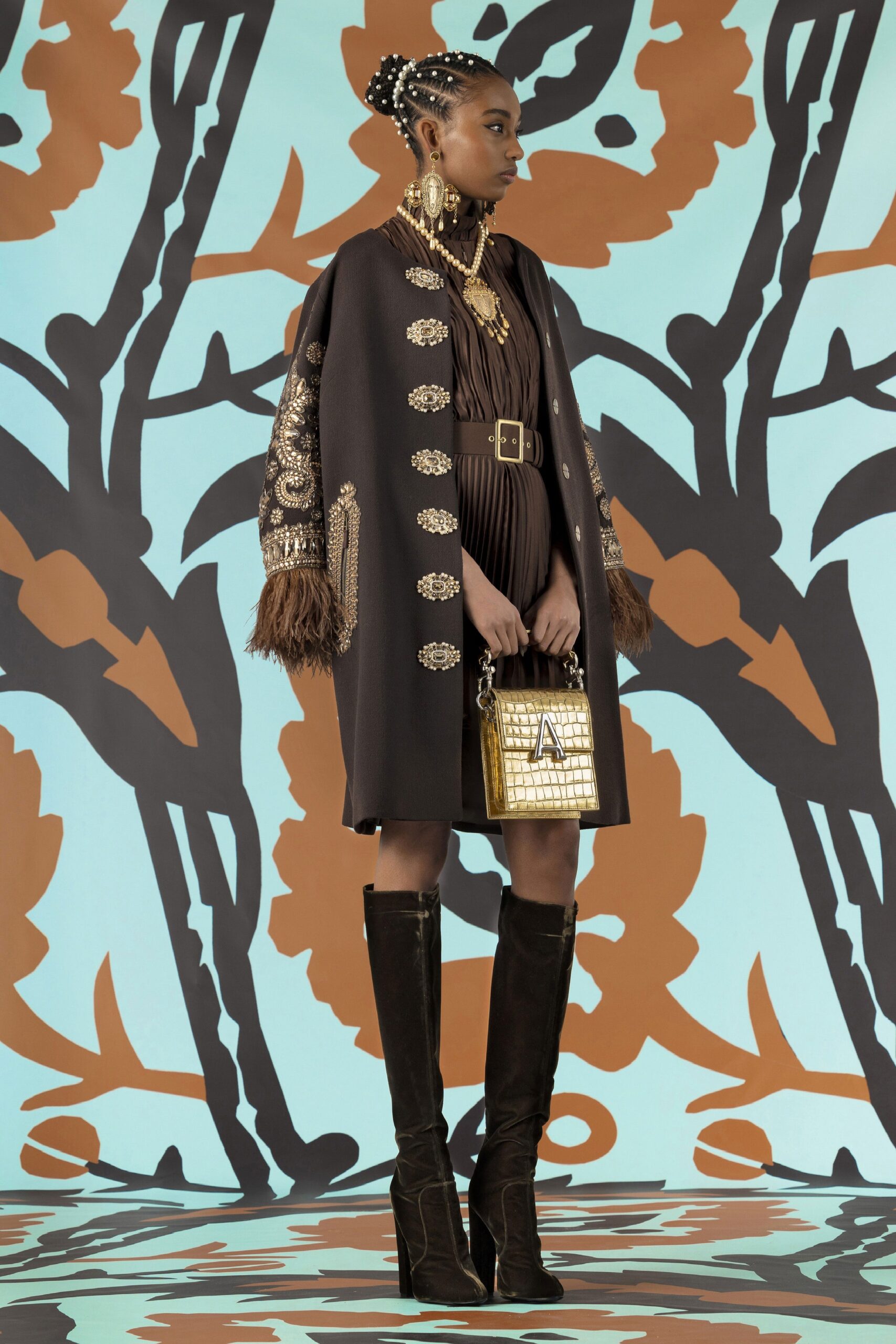 black cape and brown fitted dress