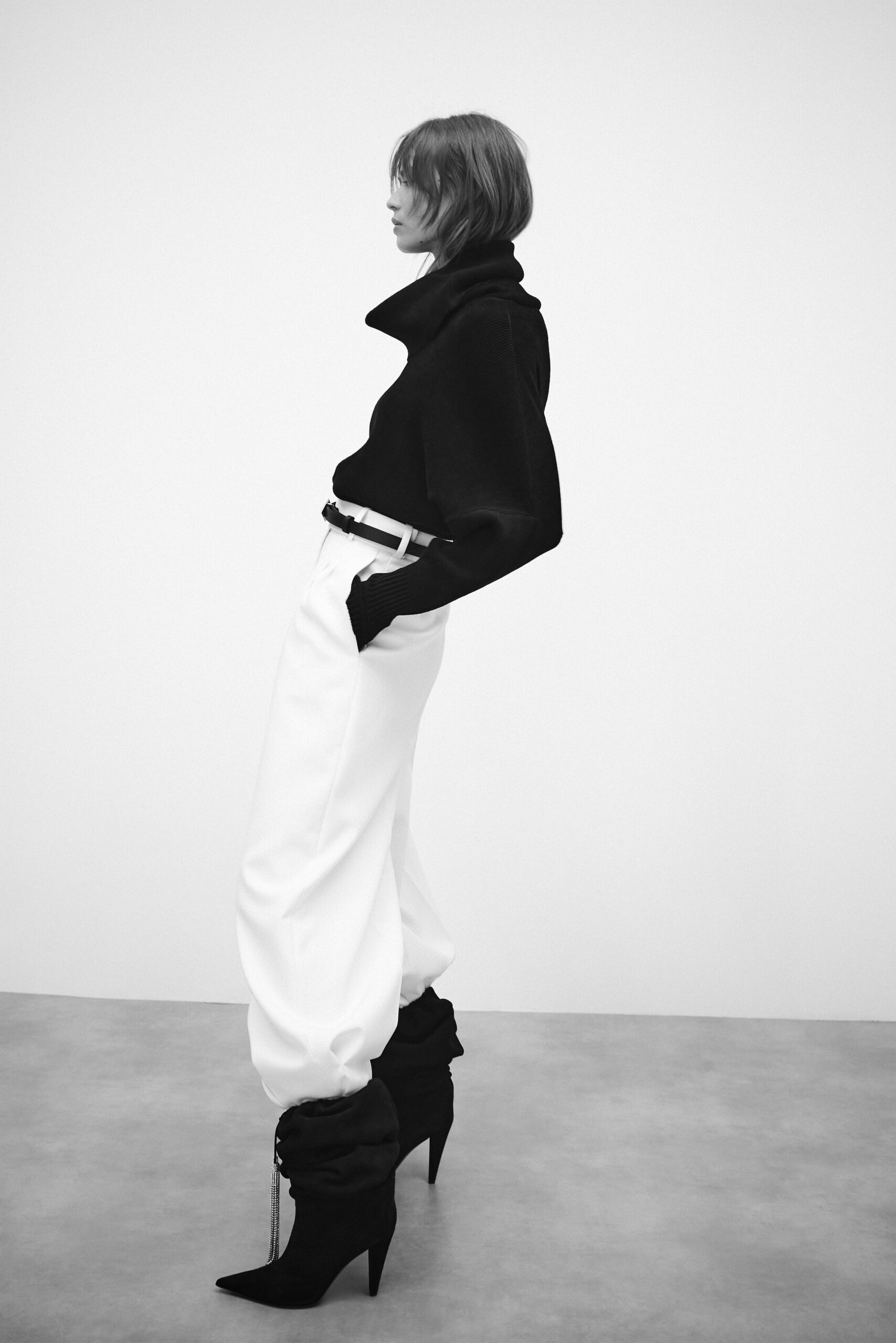 black wool top with white pants