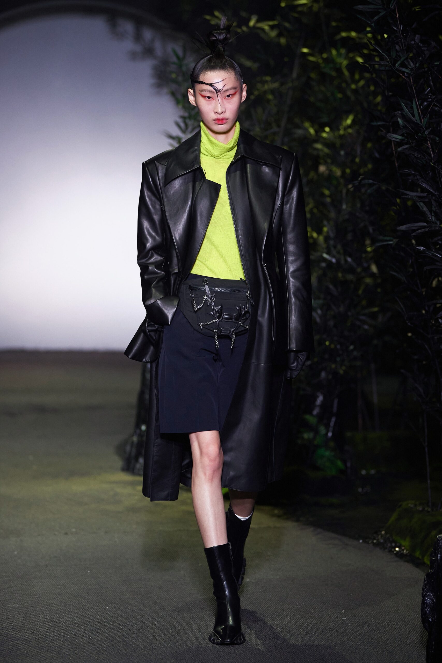 black leather coat with green top