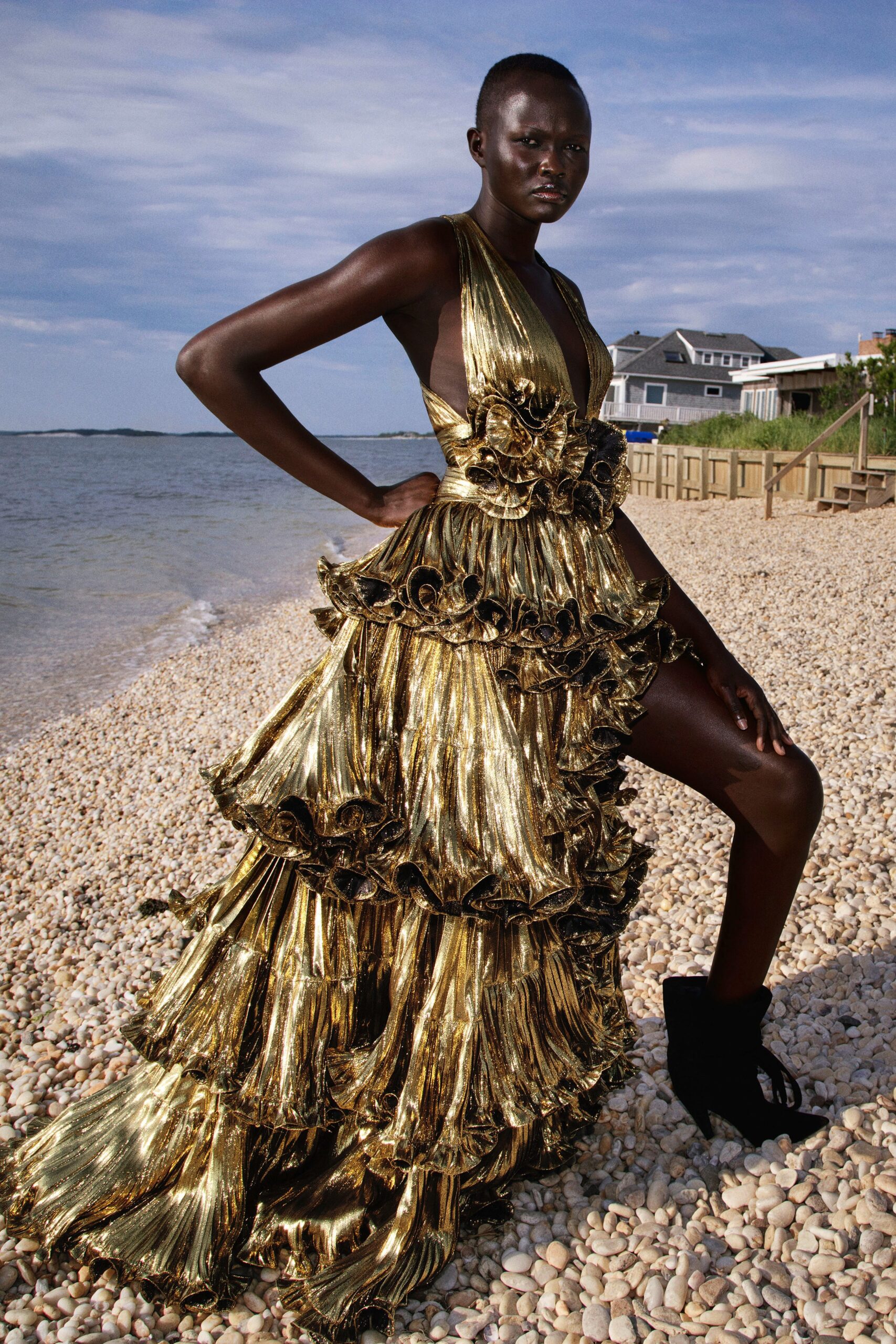 gold ruffled sleeveless gown