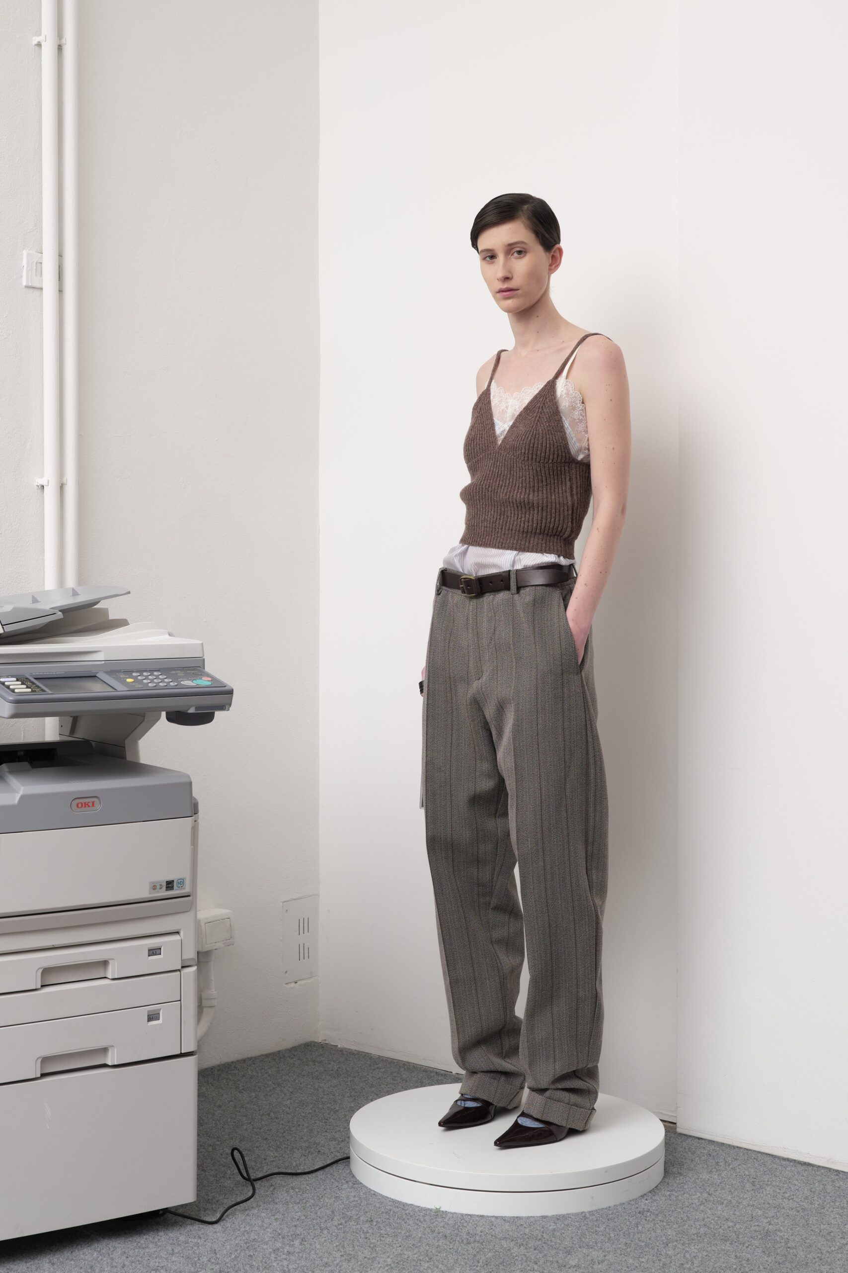 brown ribbed sleeveless top and gray tailored pants