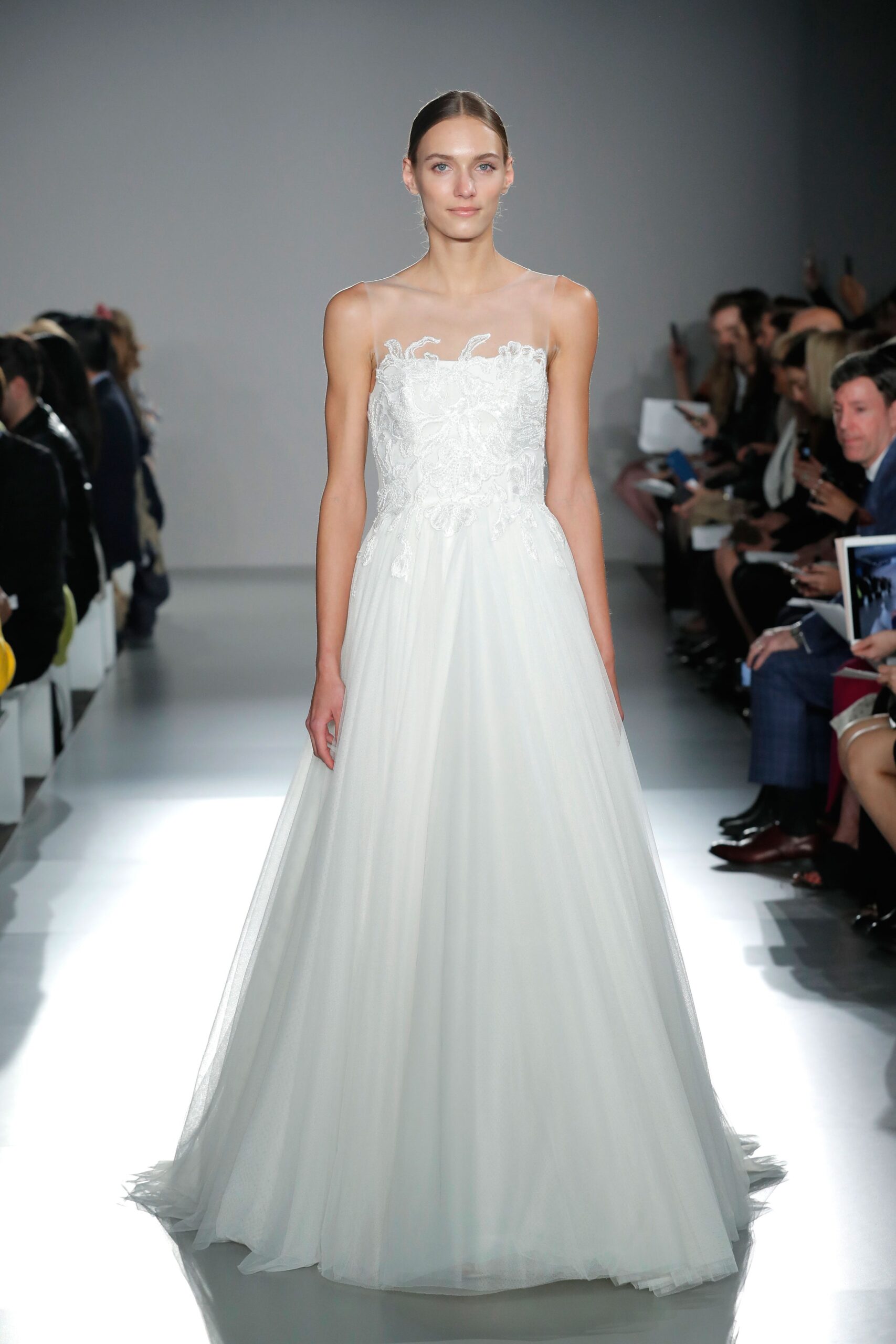 white embroidered sleeveless gown