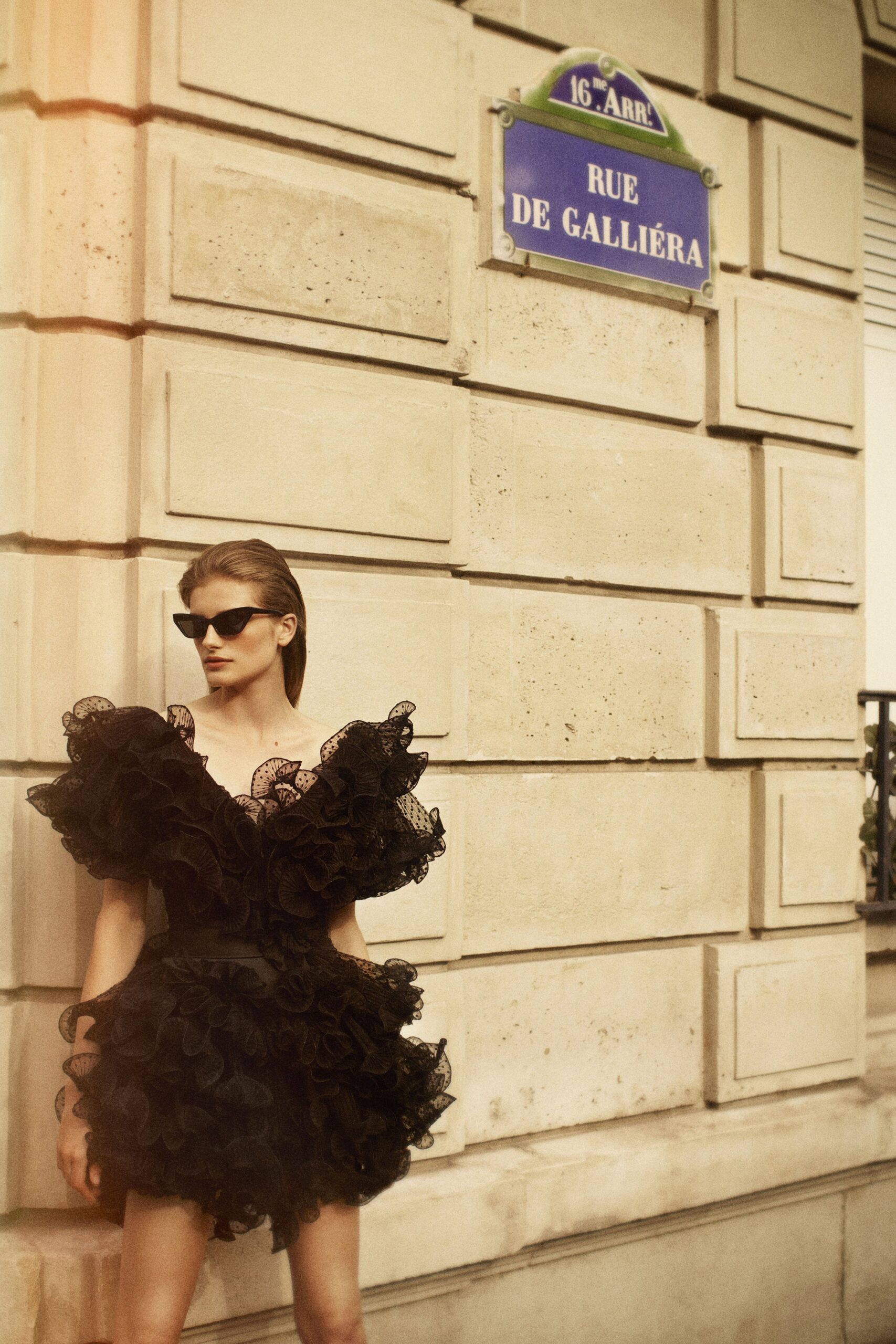black ruffled sleeveless dress