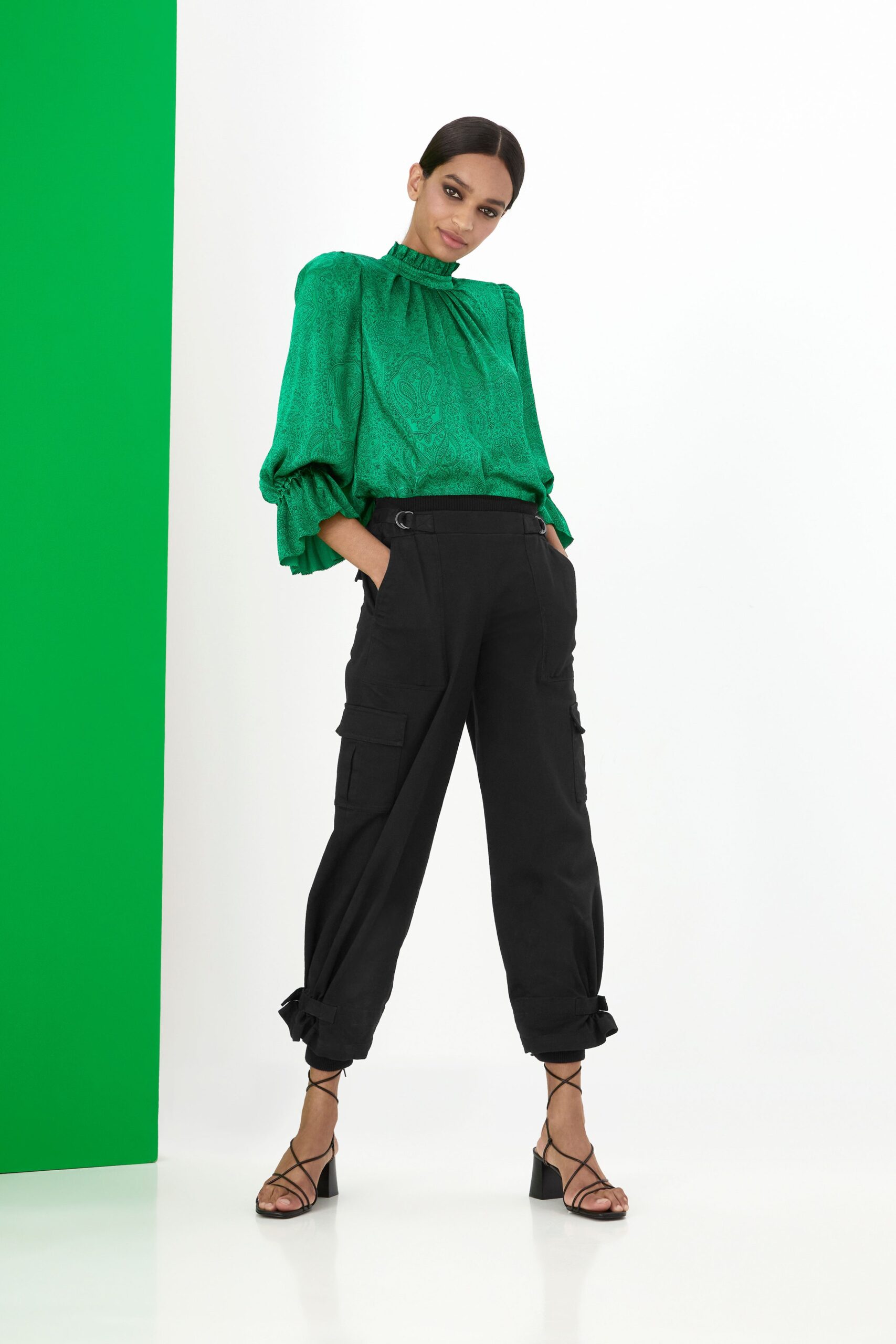 green silk blouse with cargo pants