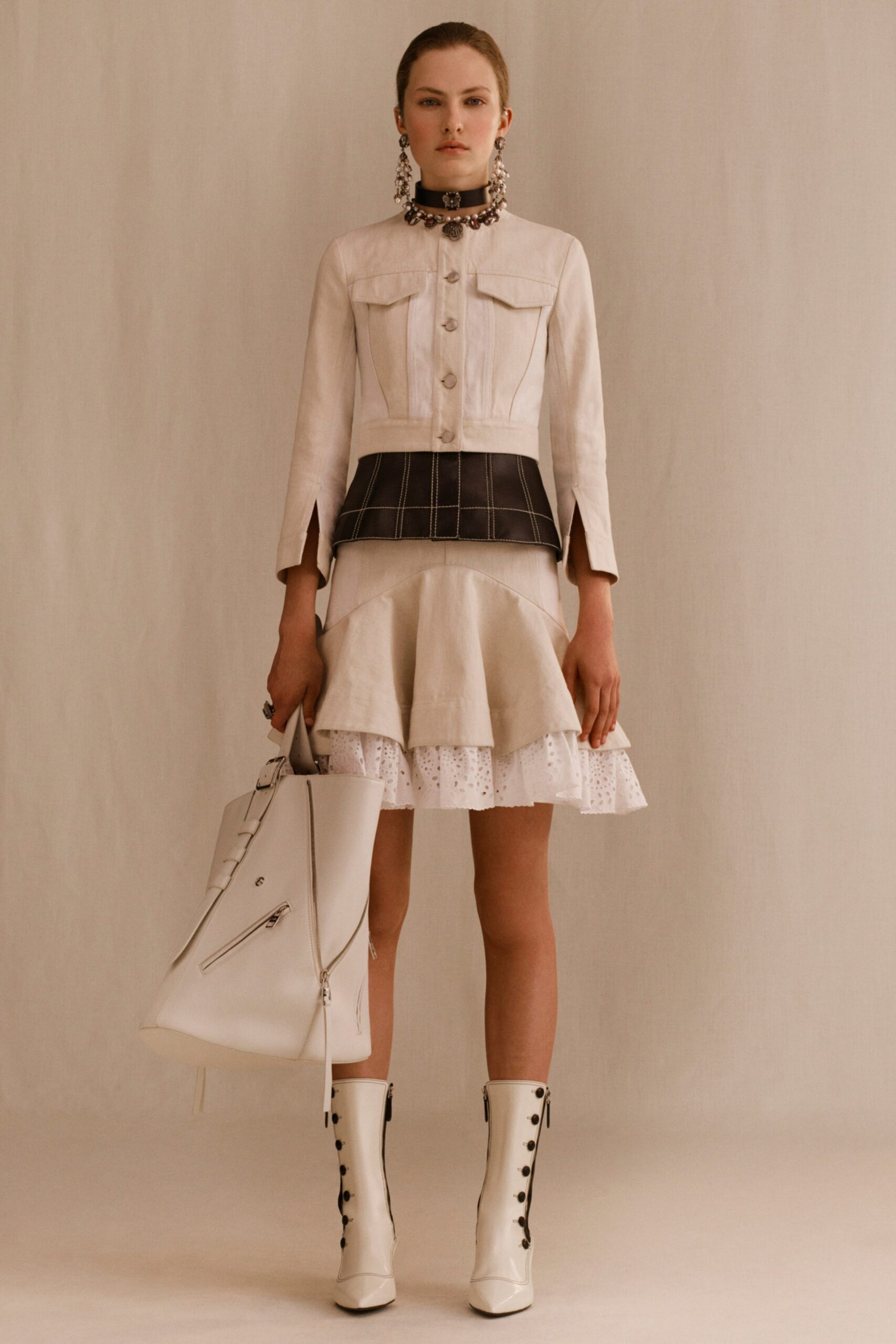 beige jacket with white mini skirt