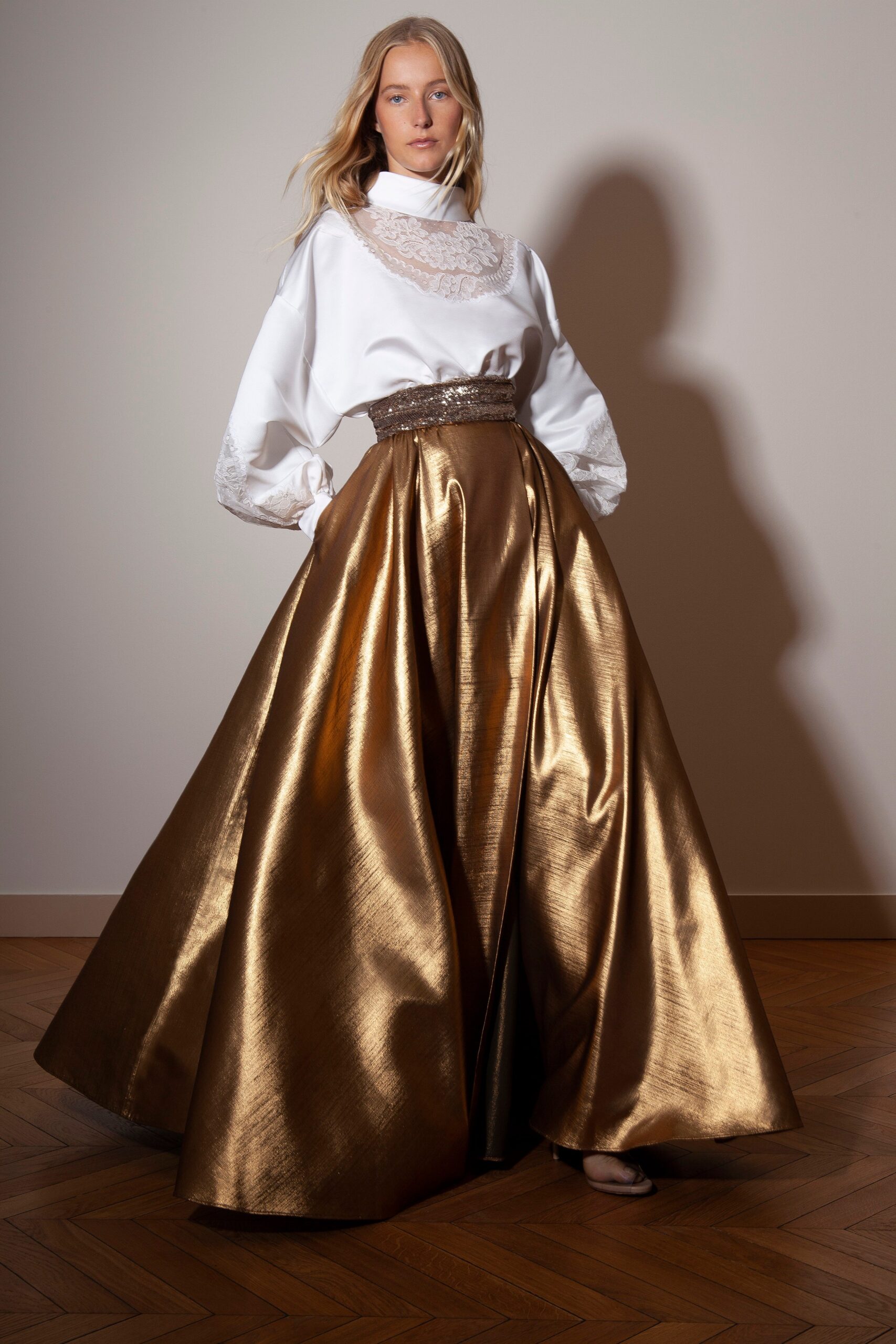 white embroidered blouse and gold skirt