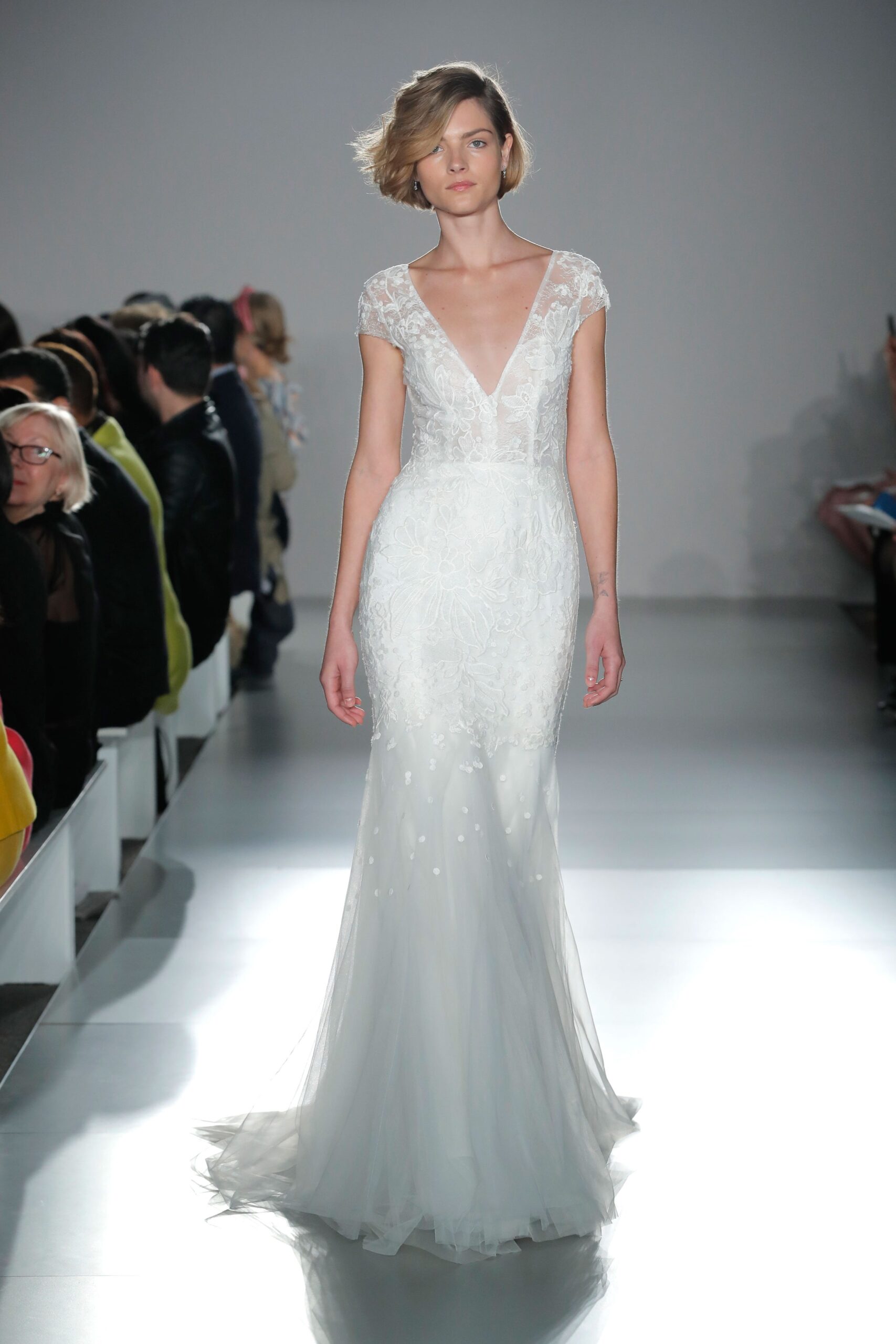 white embroidered sleeveless gown