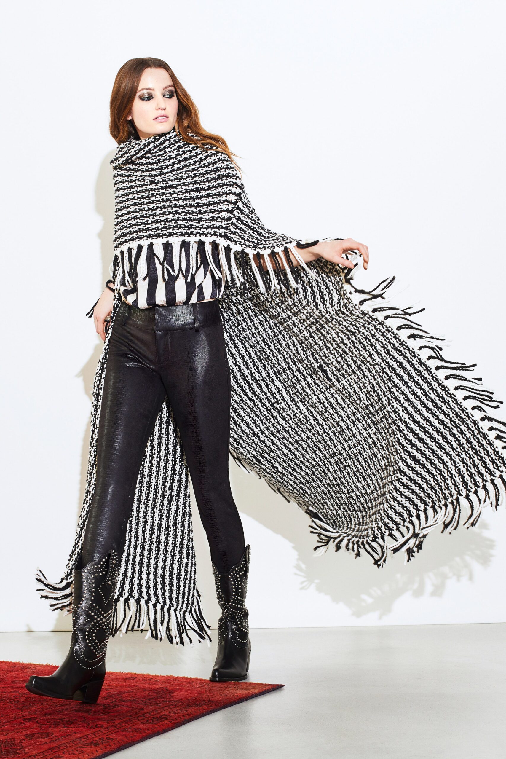 black wool sleeveless oversized fringed poncho