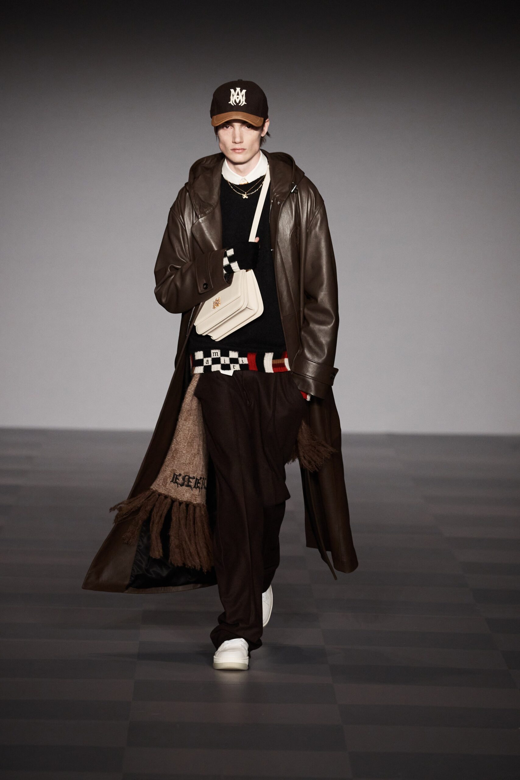 brown leather coat with black sweater