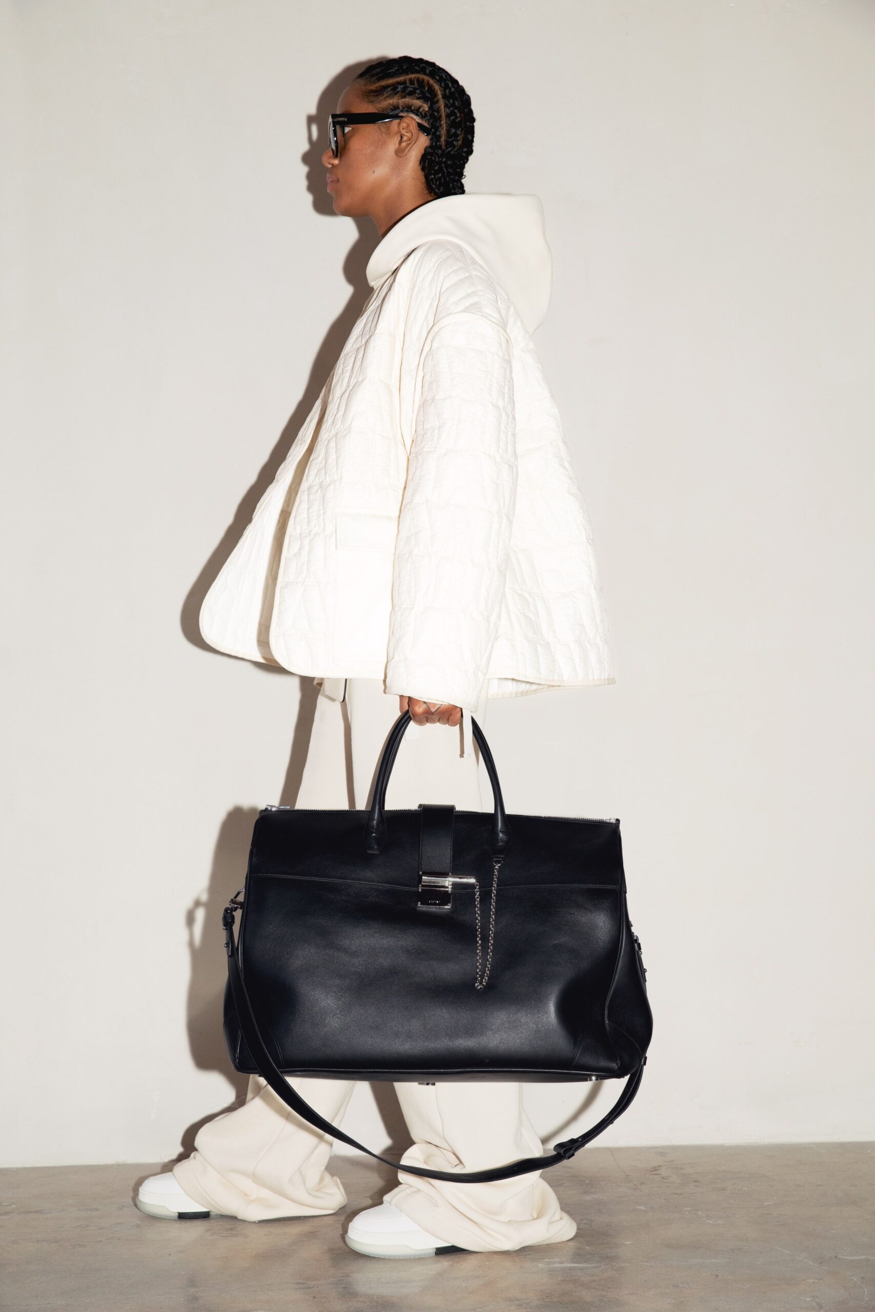 white quilted jacket with beige pants