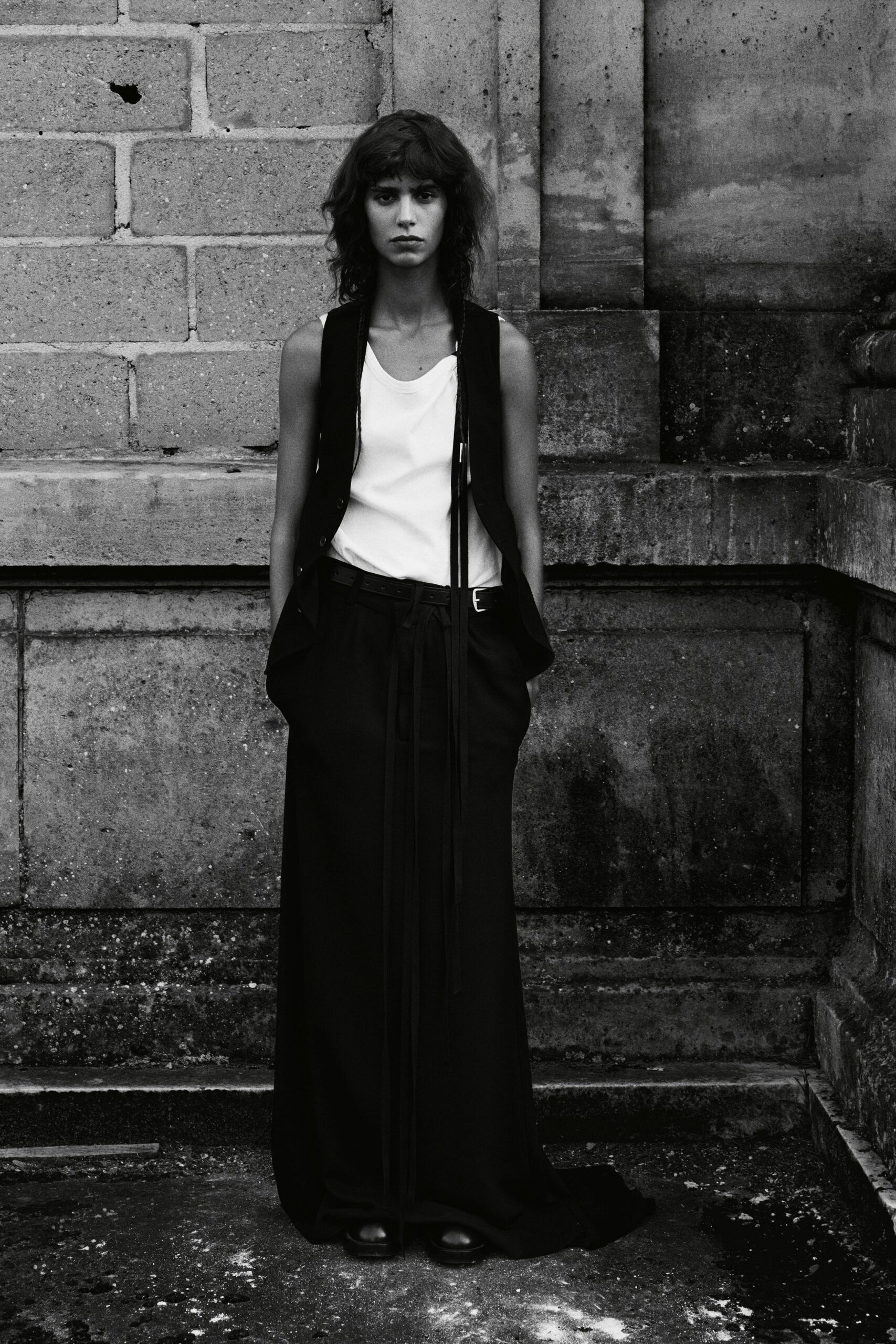 black vest white top black skirt
