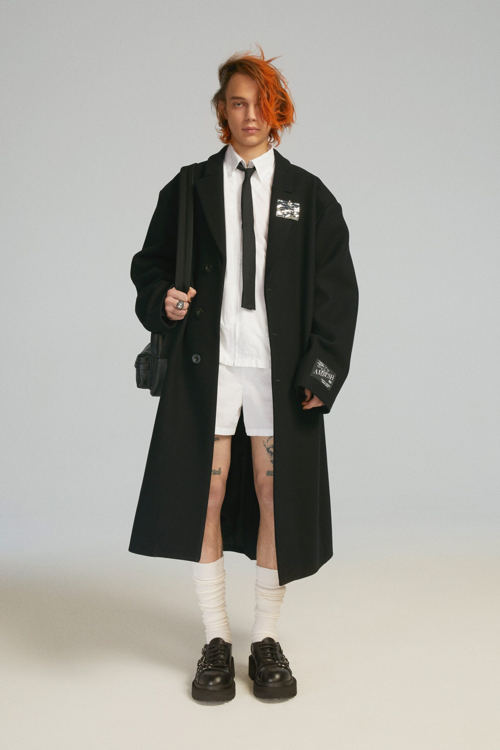 black wool long-sleeve collared oversized buttoned coat