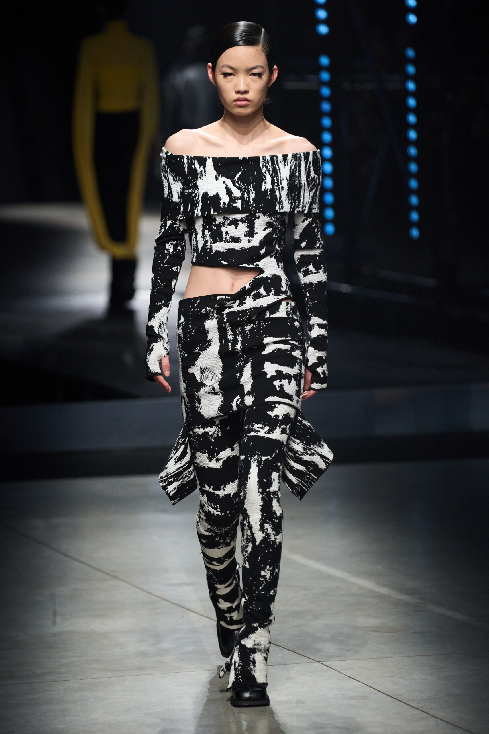 black and white ruffled top and fitted pants