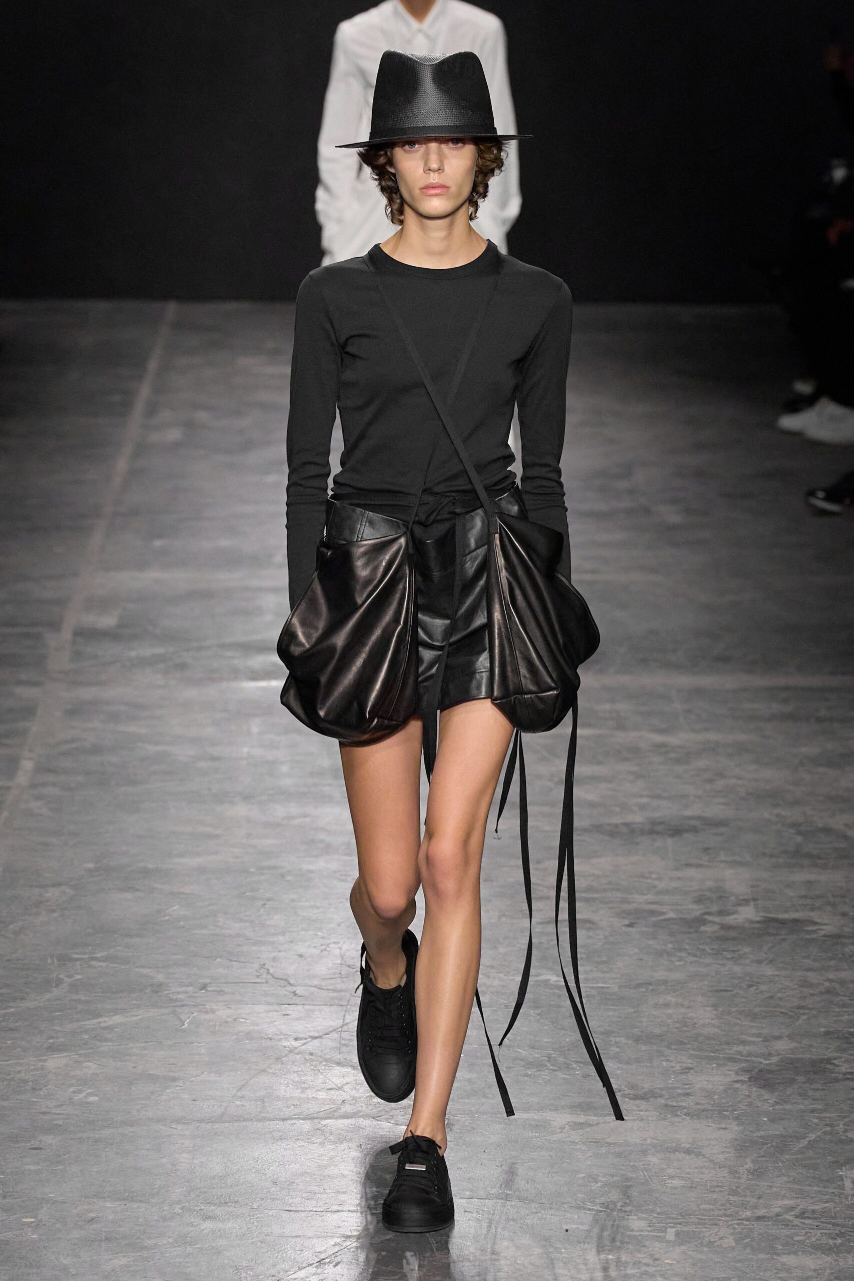 black fitted top with leather shorts