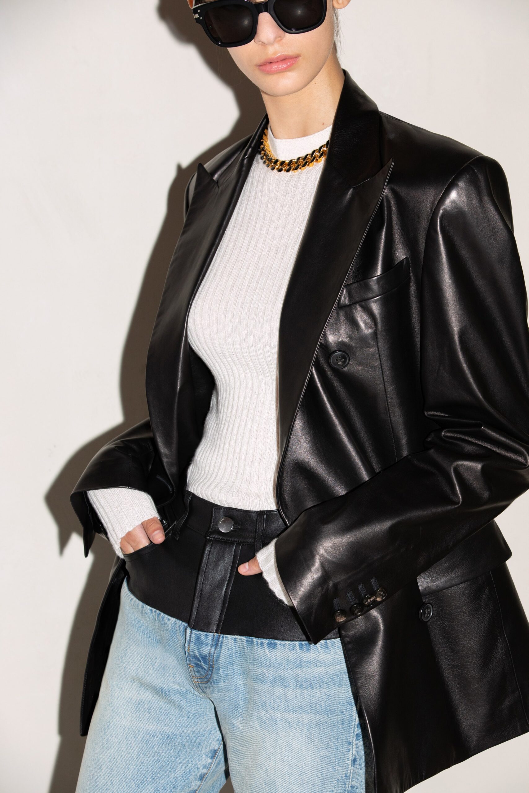 black leather blazer with white top