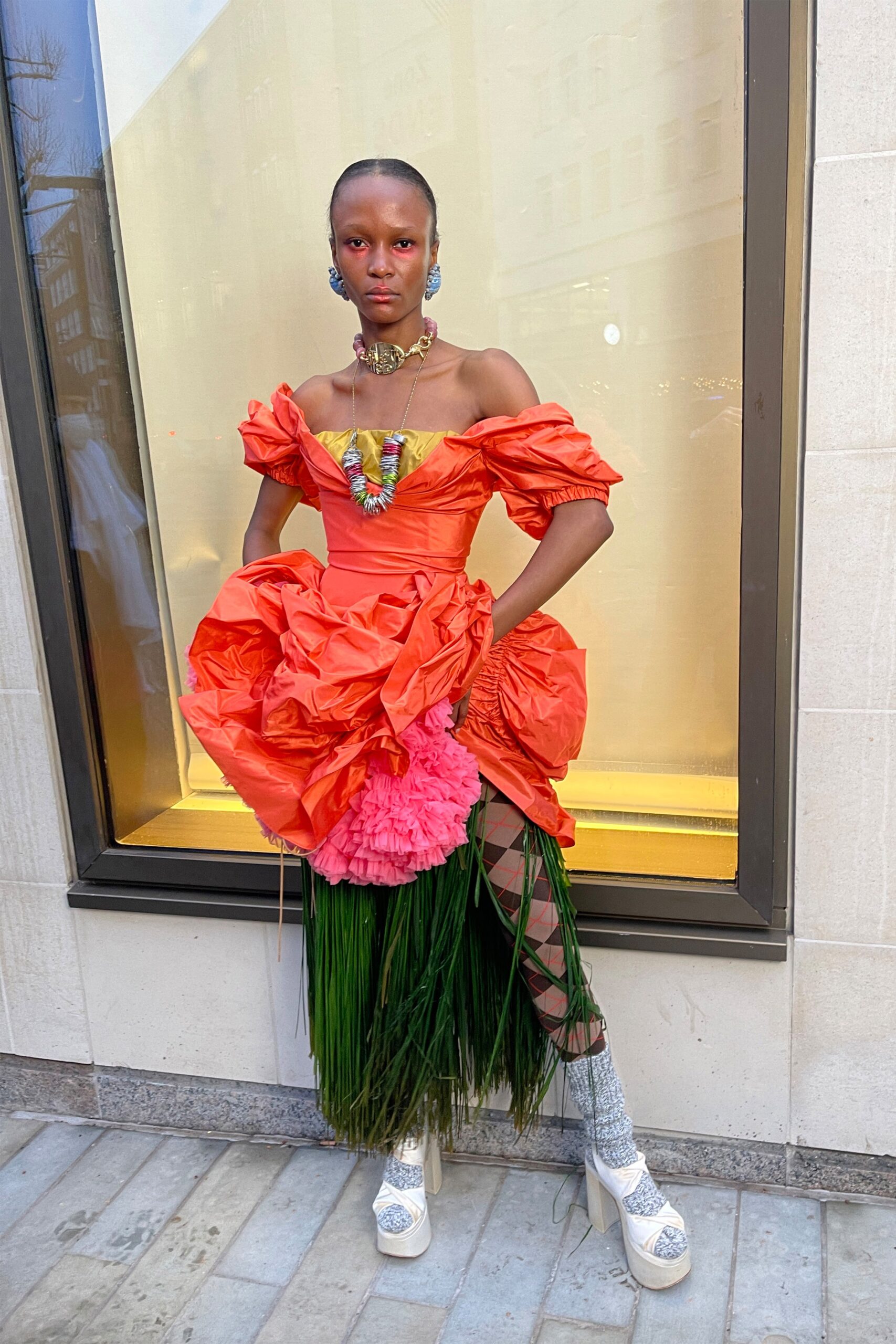 orange ruffled midi dress with platform shoes