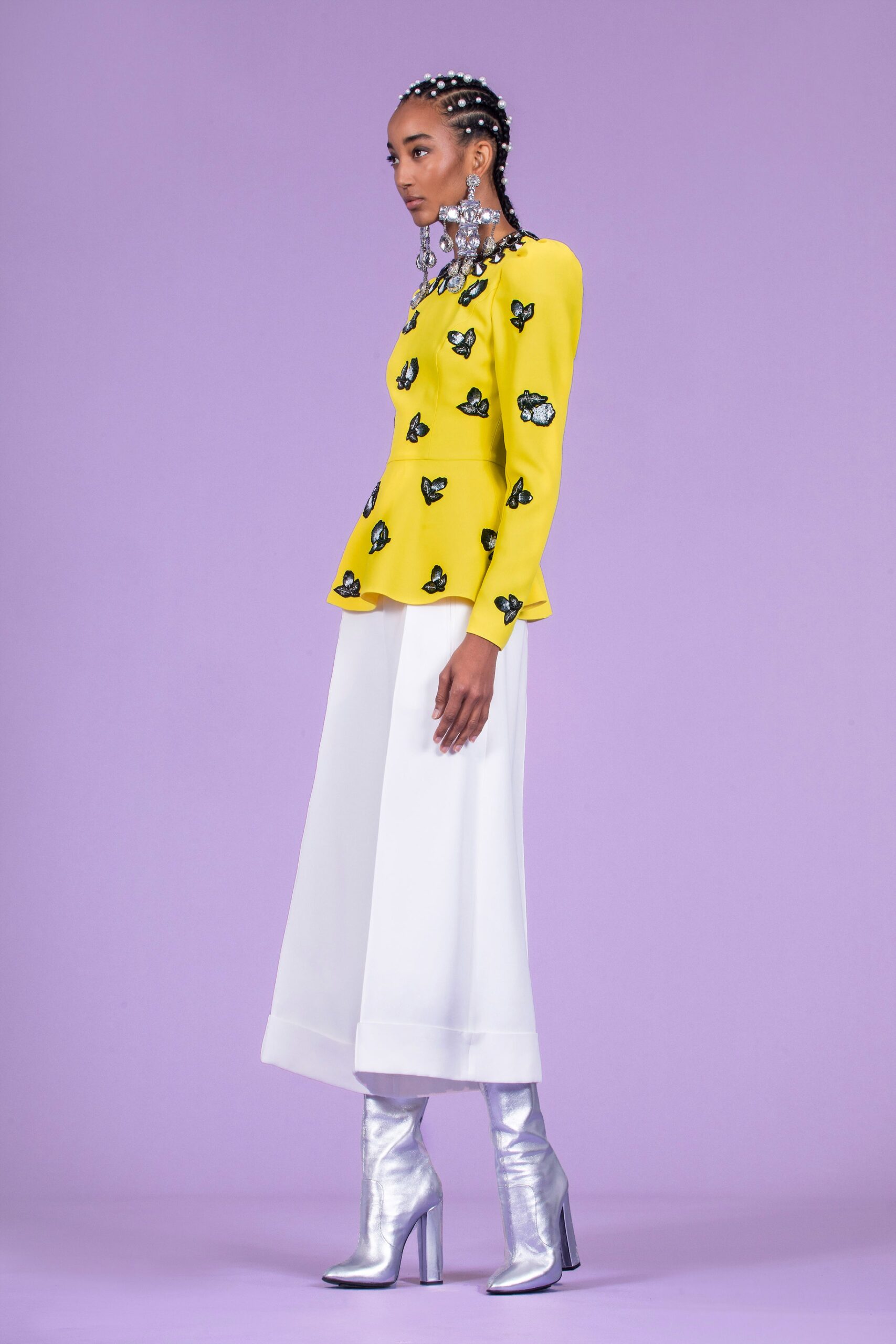 yellow embroidered top with white pants