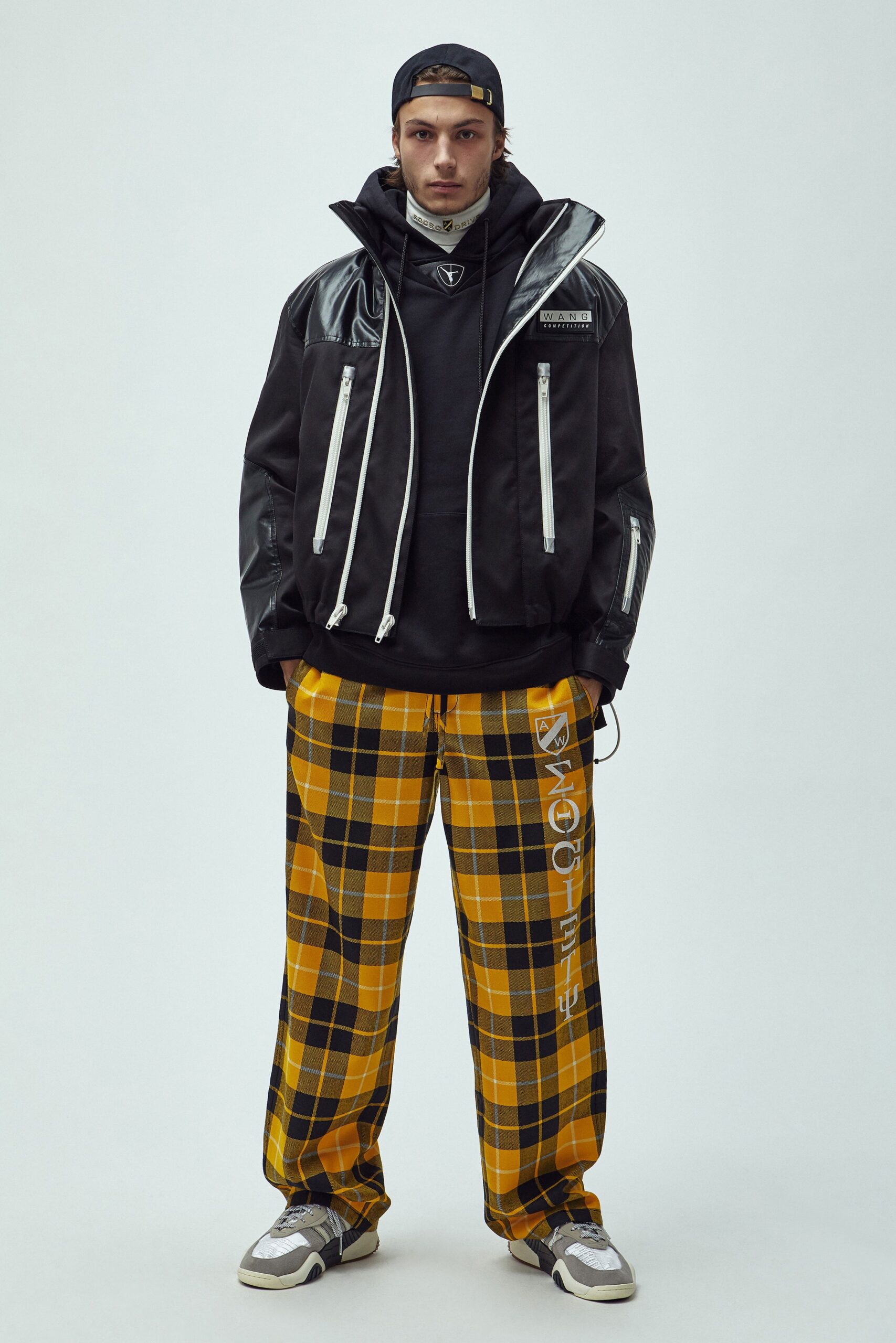 black vinyl jacket with hoodie and checked pants