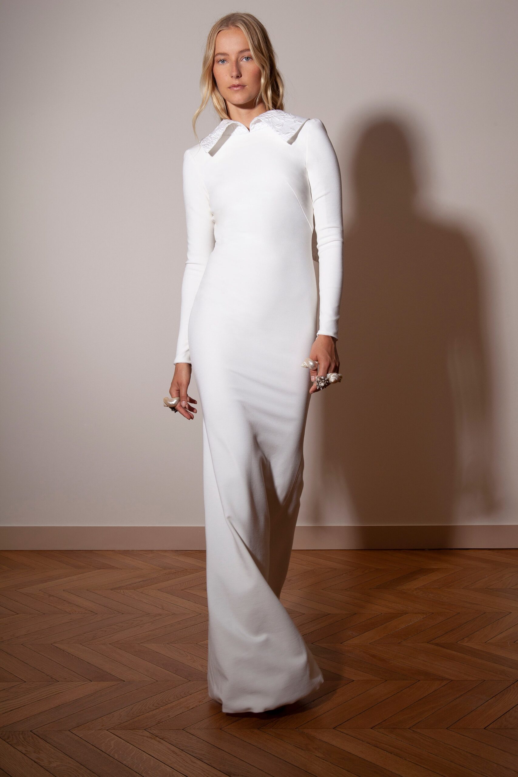 fitted white long-sleeve gown