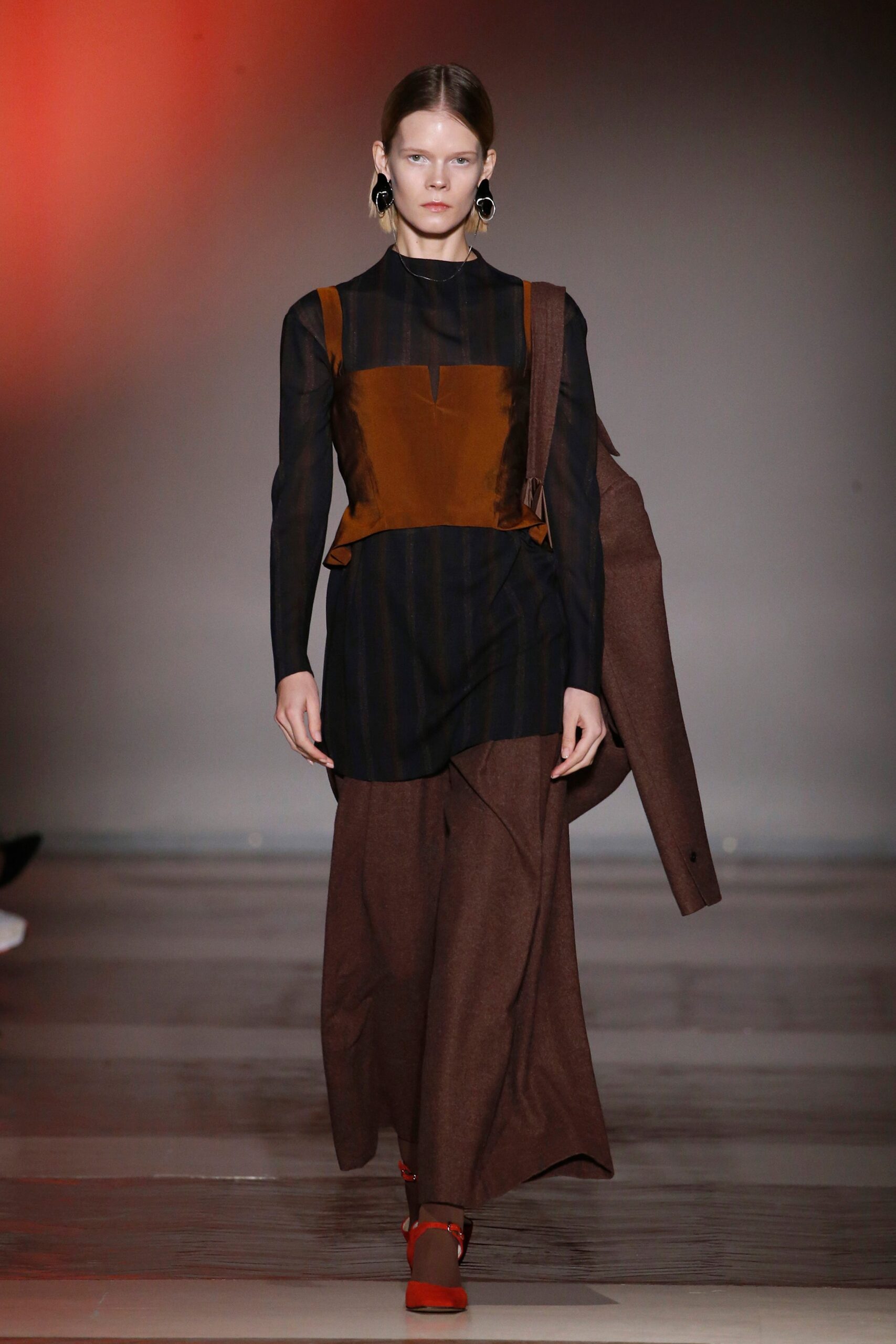 black and brown layered top with wide-leg pants