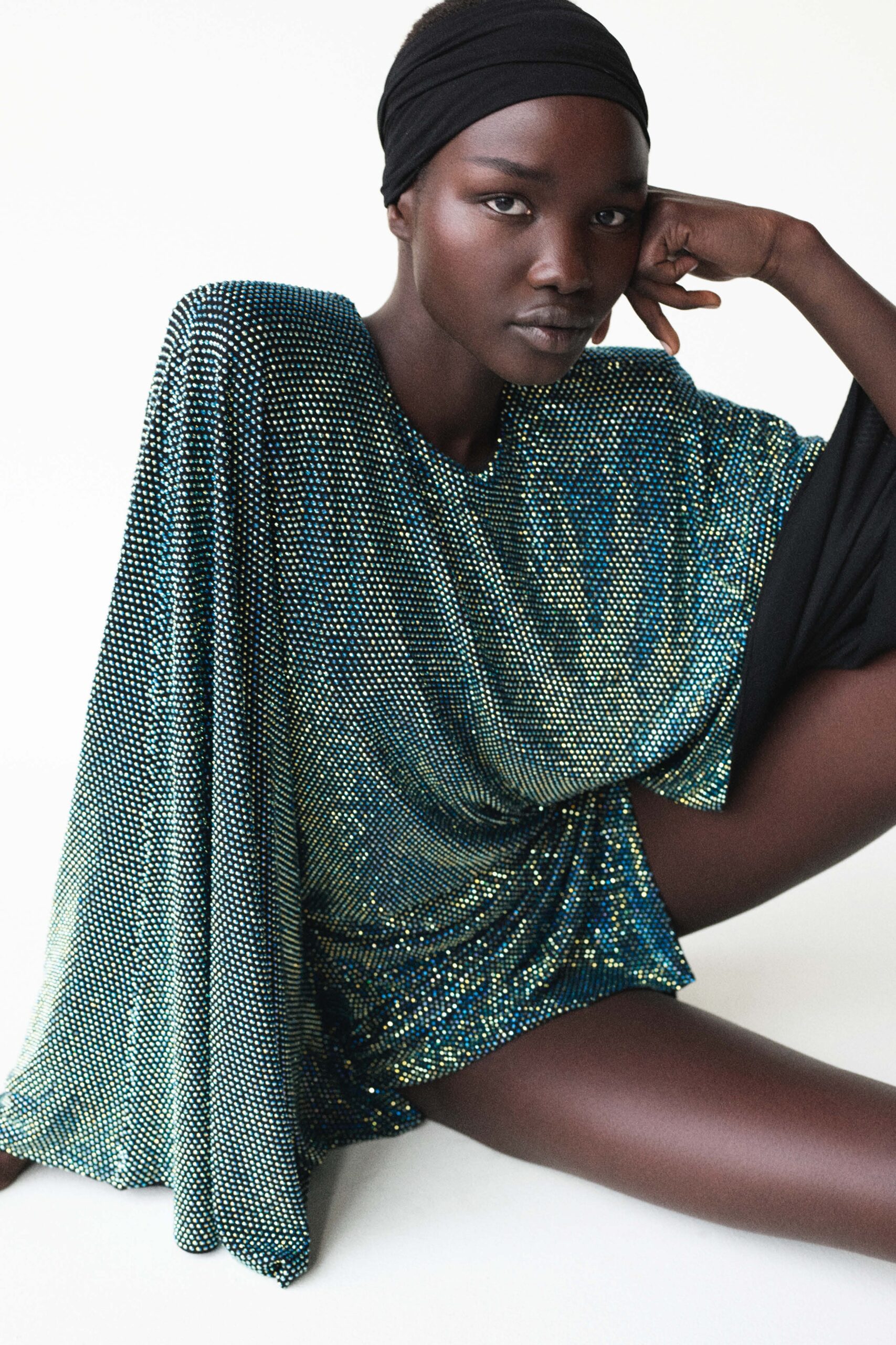 shiny black and blue draped dress