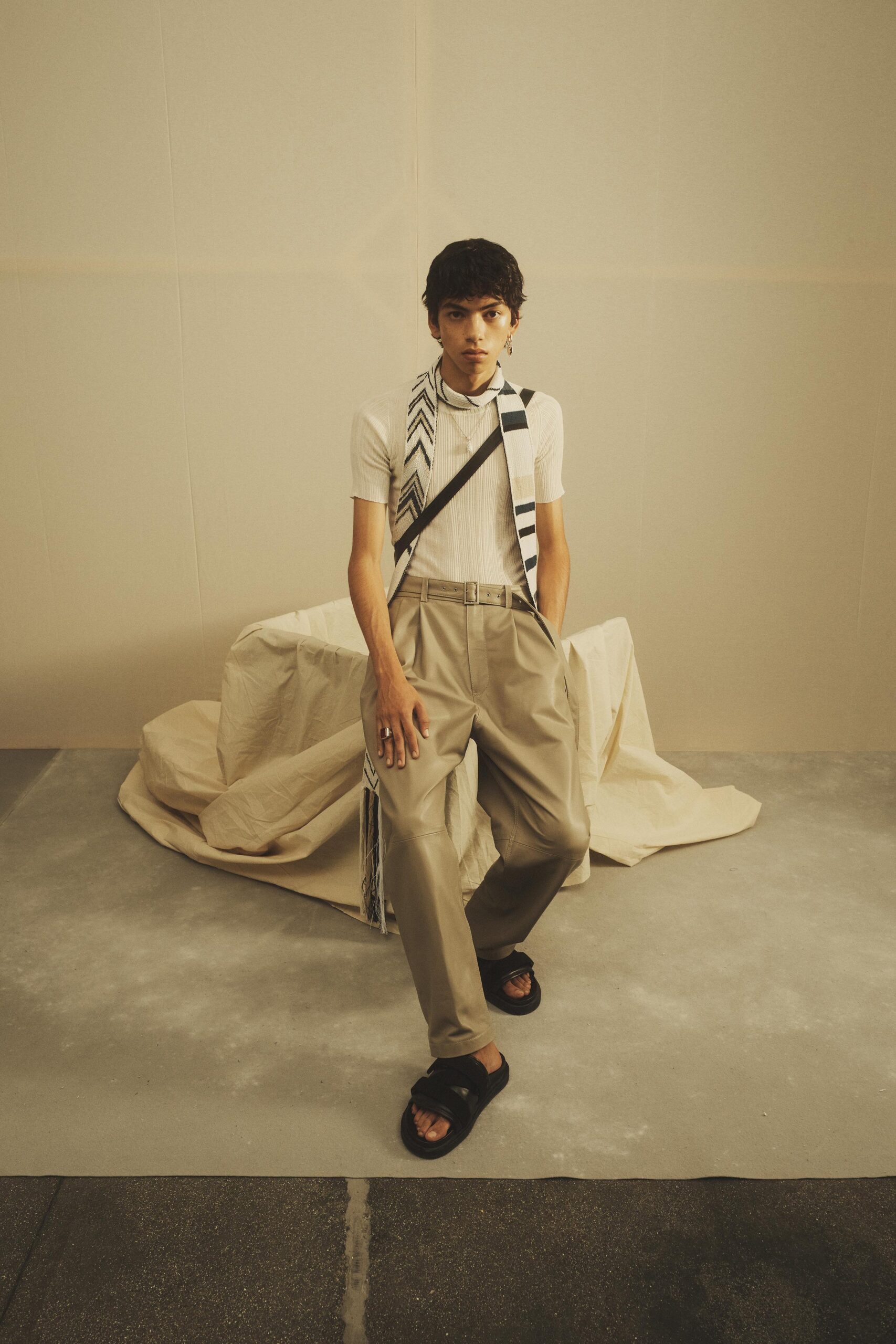 white fitted shirt with beige pants