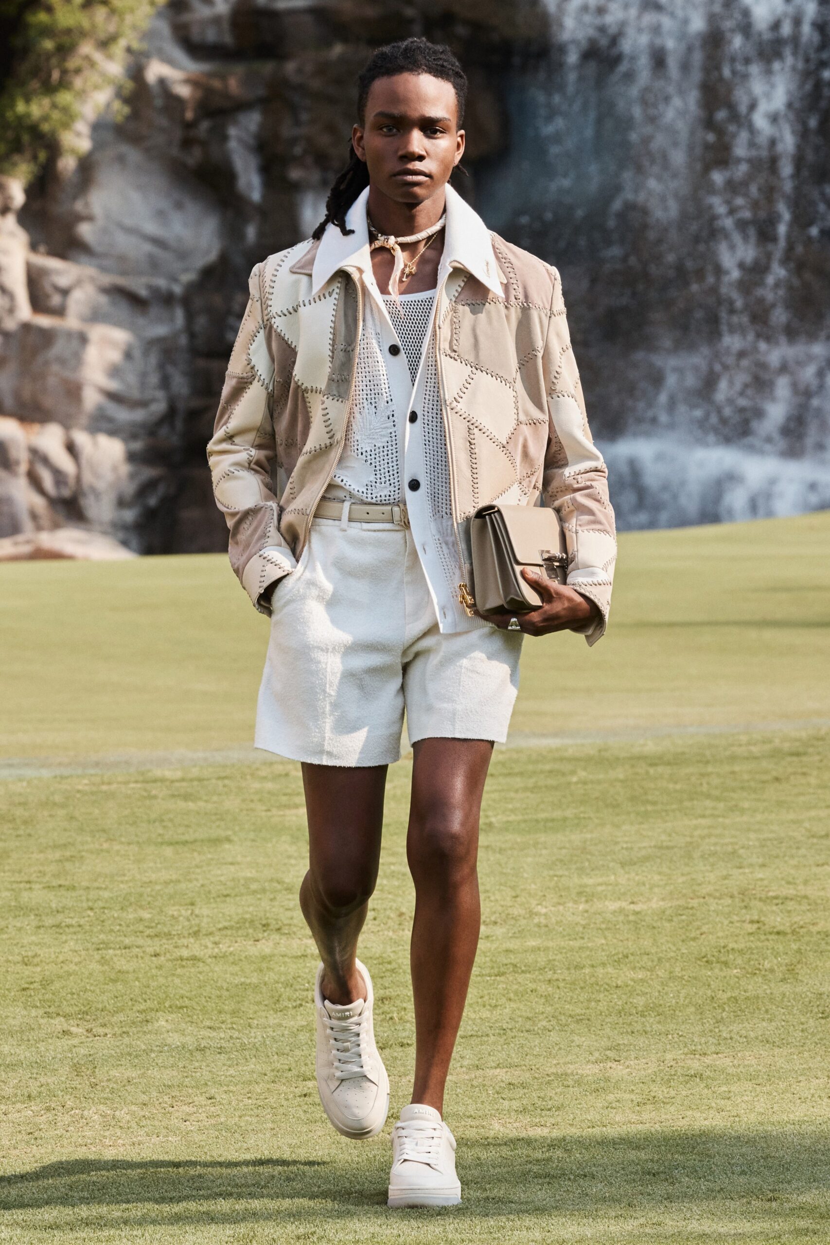 beige jacket with white shirt and shorts