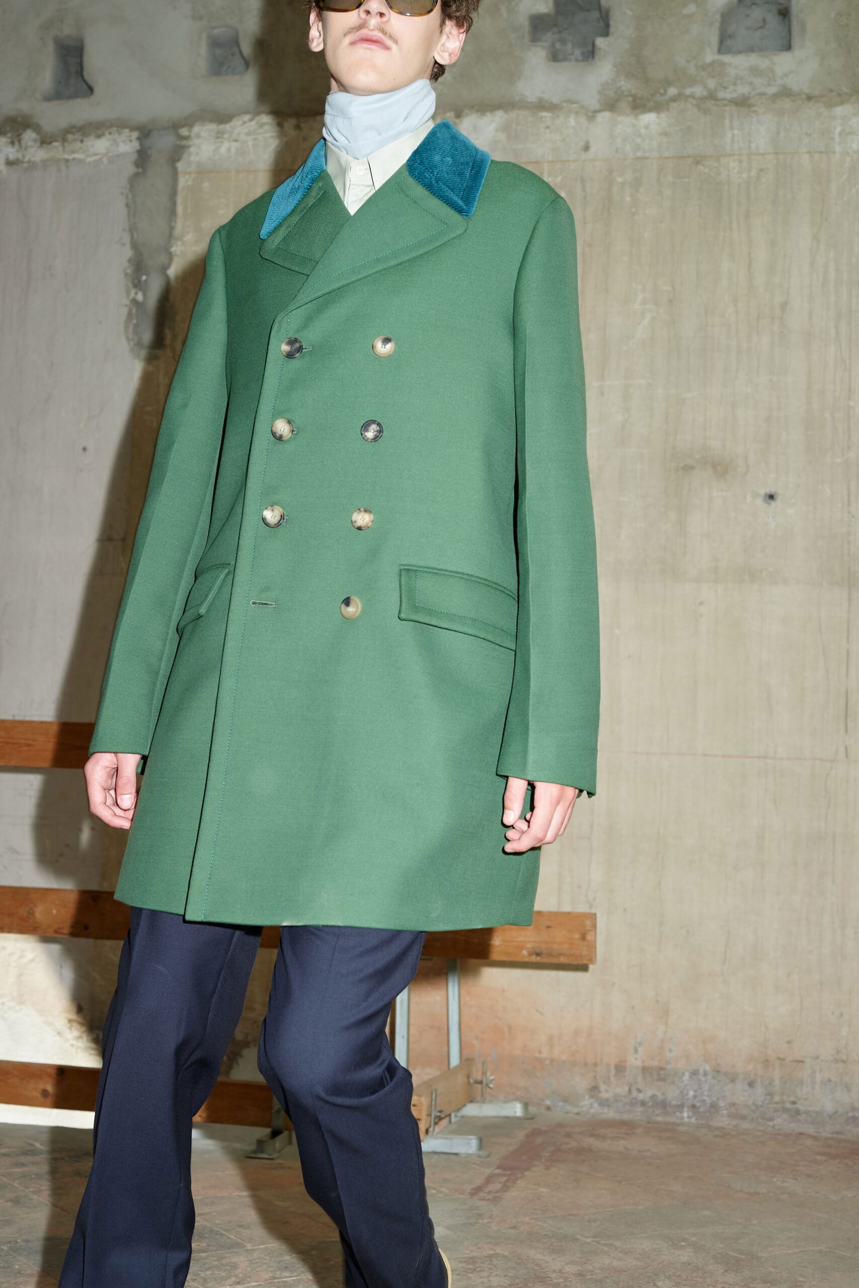 green wool coat with navy pants