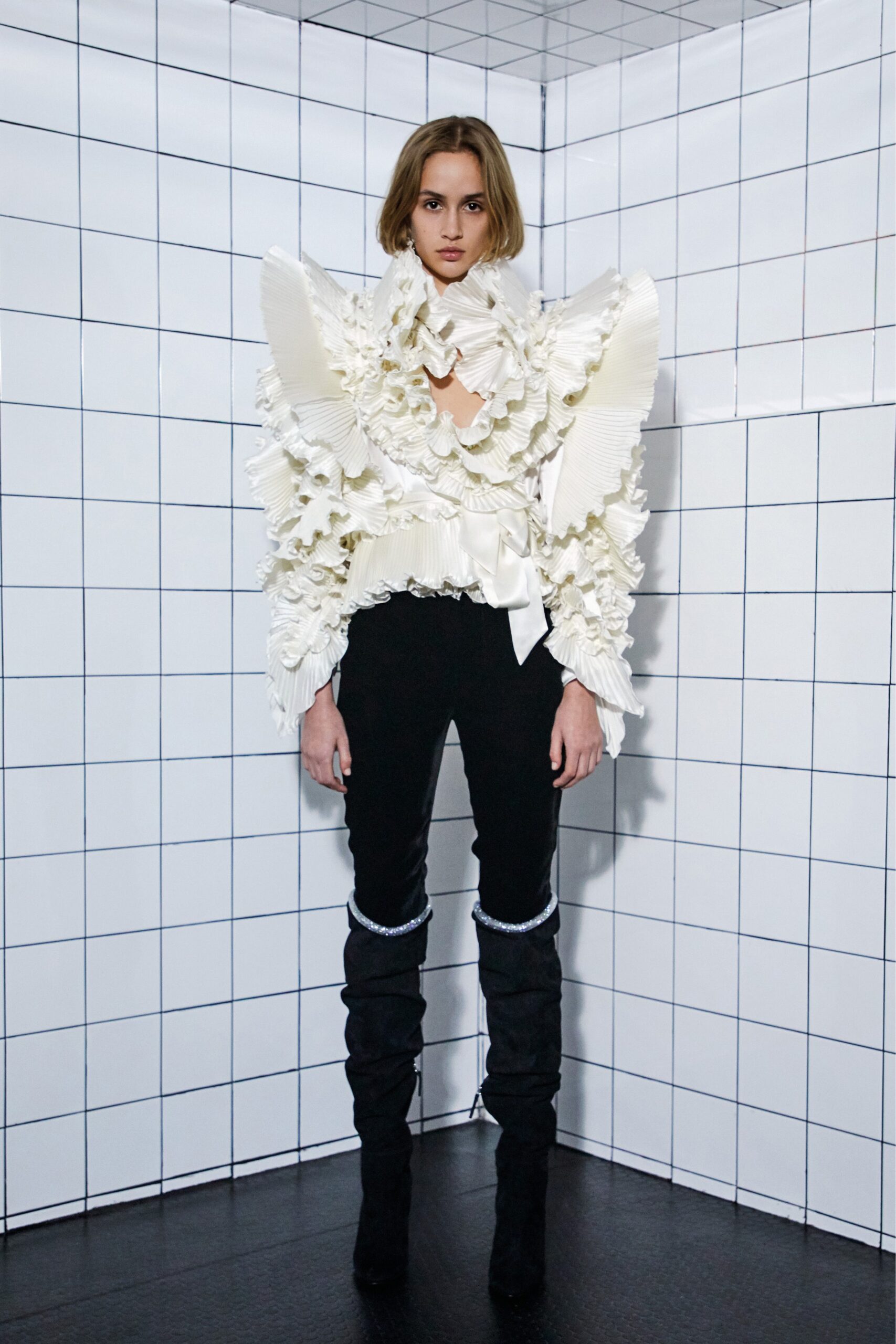 white ruffled top and black pants